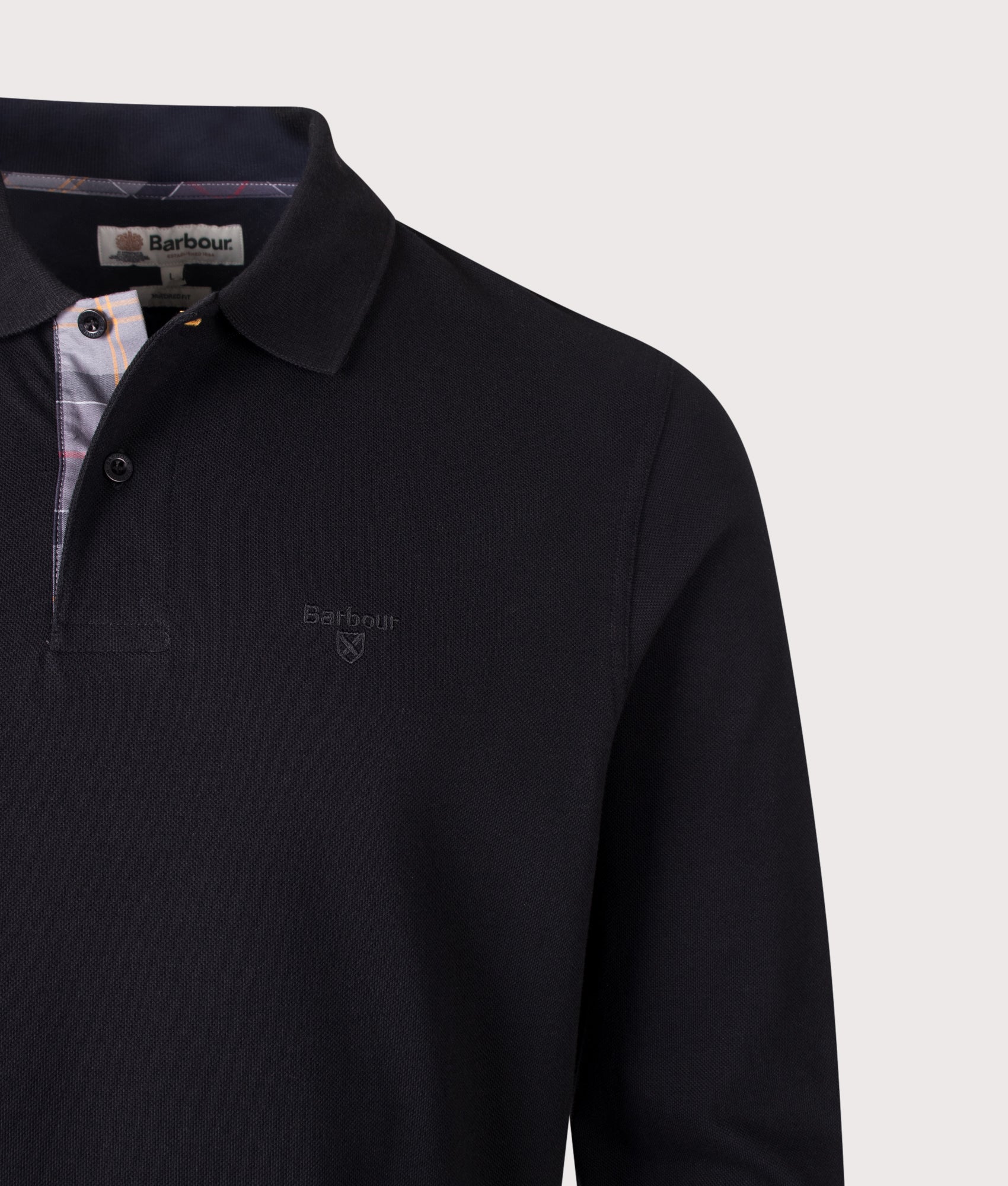 Barbour Lifestyle Regular Fit Essential Long Sleeve Tartan Piqué Polo Shirt in Black at EQVVS Menswear. Detail shot.
