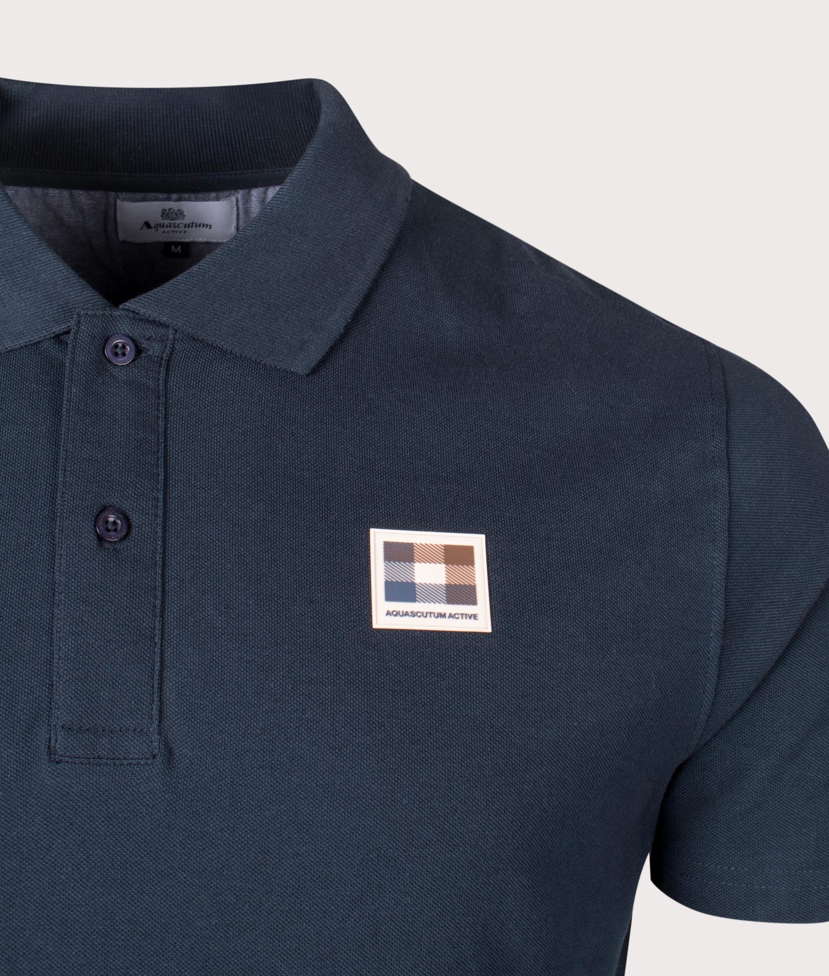 Active Check Patch Polo Shirt in Navy by Aquascutum. EQVVS detail shot.