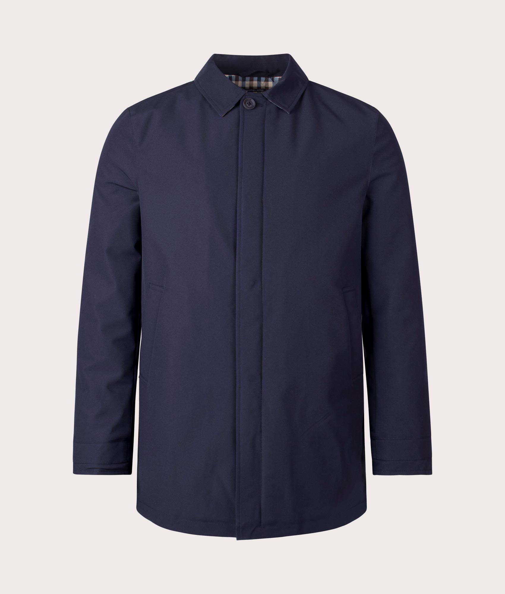 100% Polyester Active Shell Trench Coat in Navy by Aquascutum. Shot at EQVVS. Front shot. 