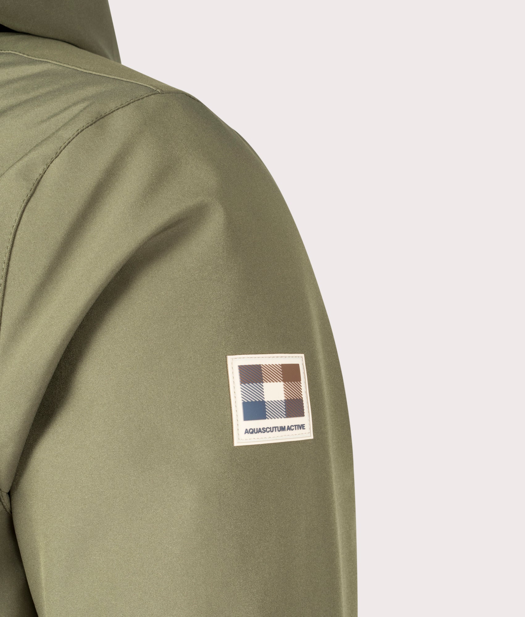 Shell Active Mid Parka Army Green by Aquascutum. Shot at EQVVS. Detail shot. 