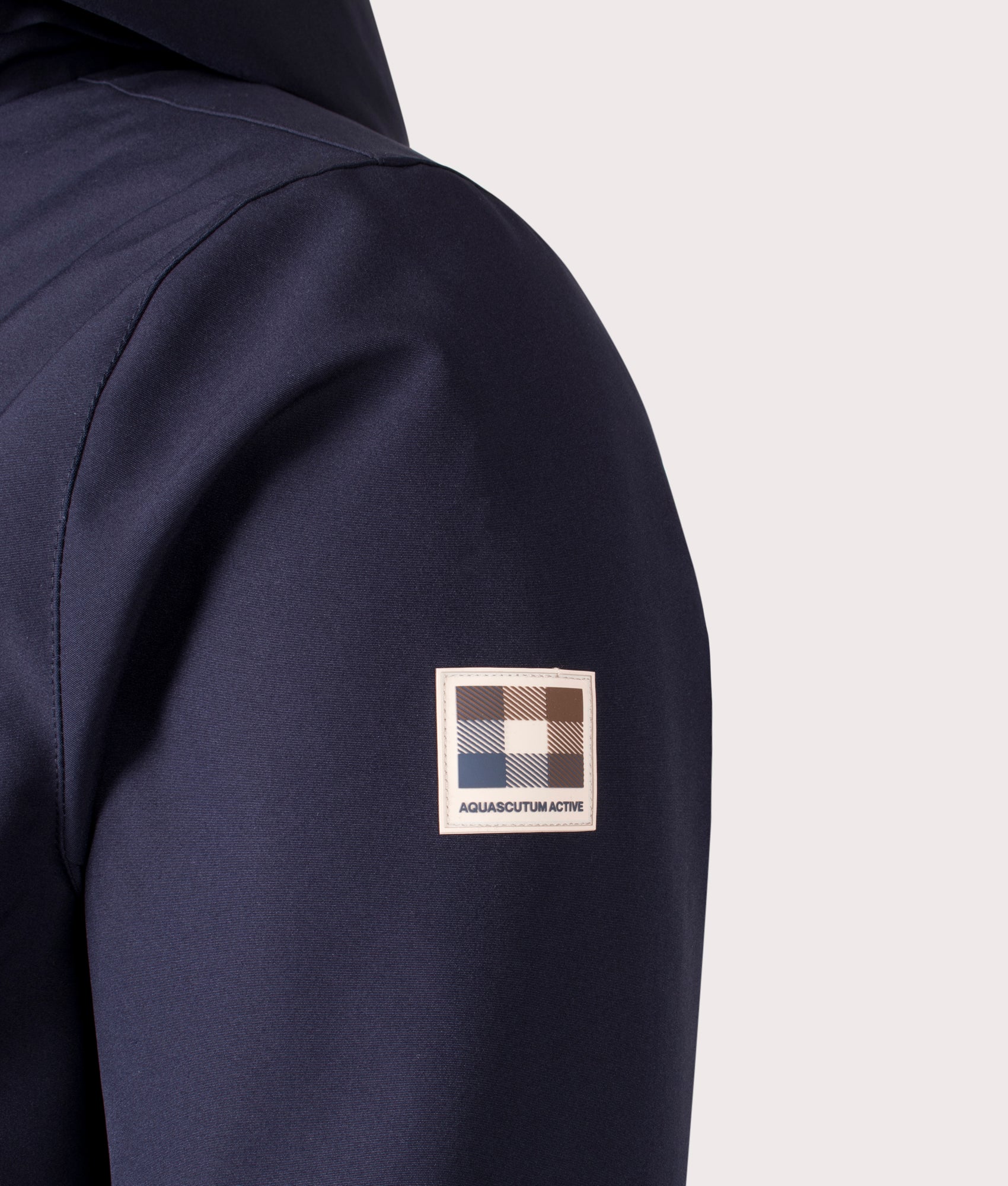 Aquascutum Active Mid Shell Parka in Navy. Shot at EQVVS. Detail shot. 