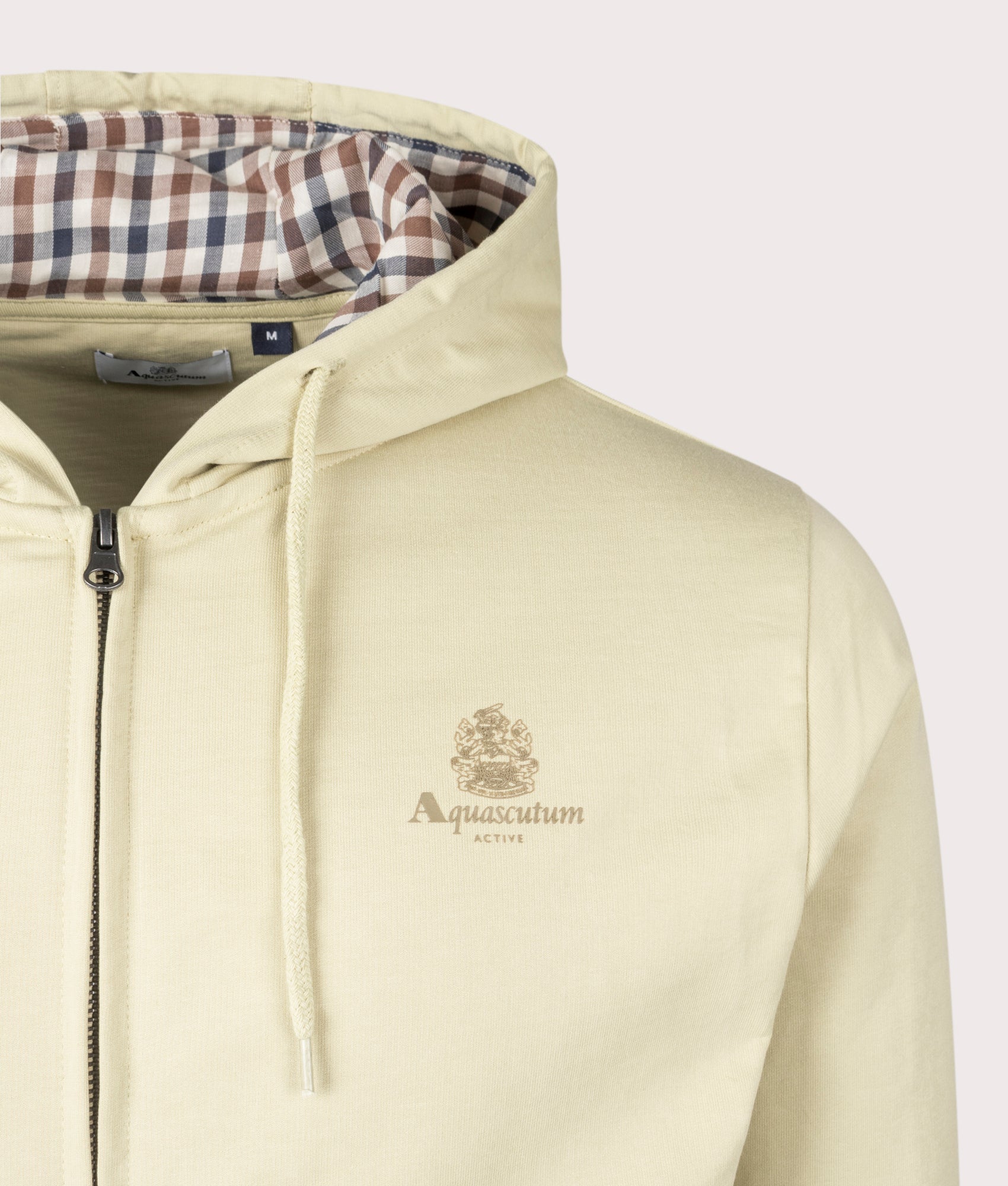 Aquascutum Small Logo Full Zip Sweatshirt in Beige, 100% cotton at EQVVS. Detailed logo shot. 