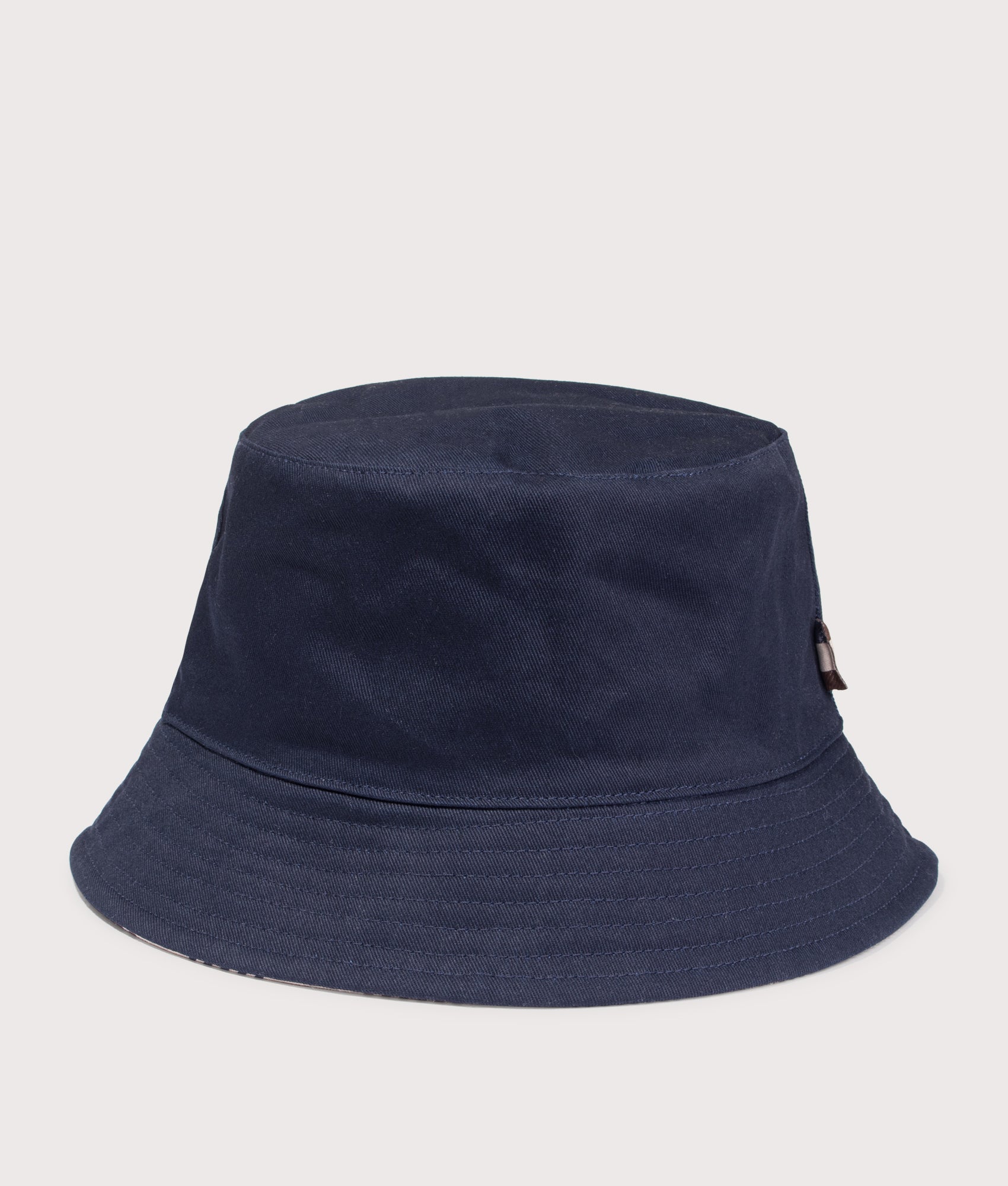 Reversible Club Check Bucket Hat. Shot by EQVVS. Front shot.