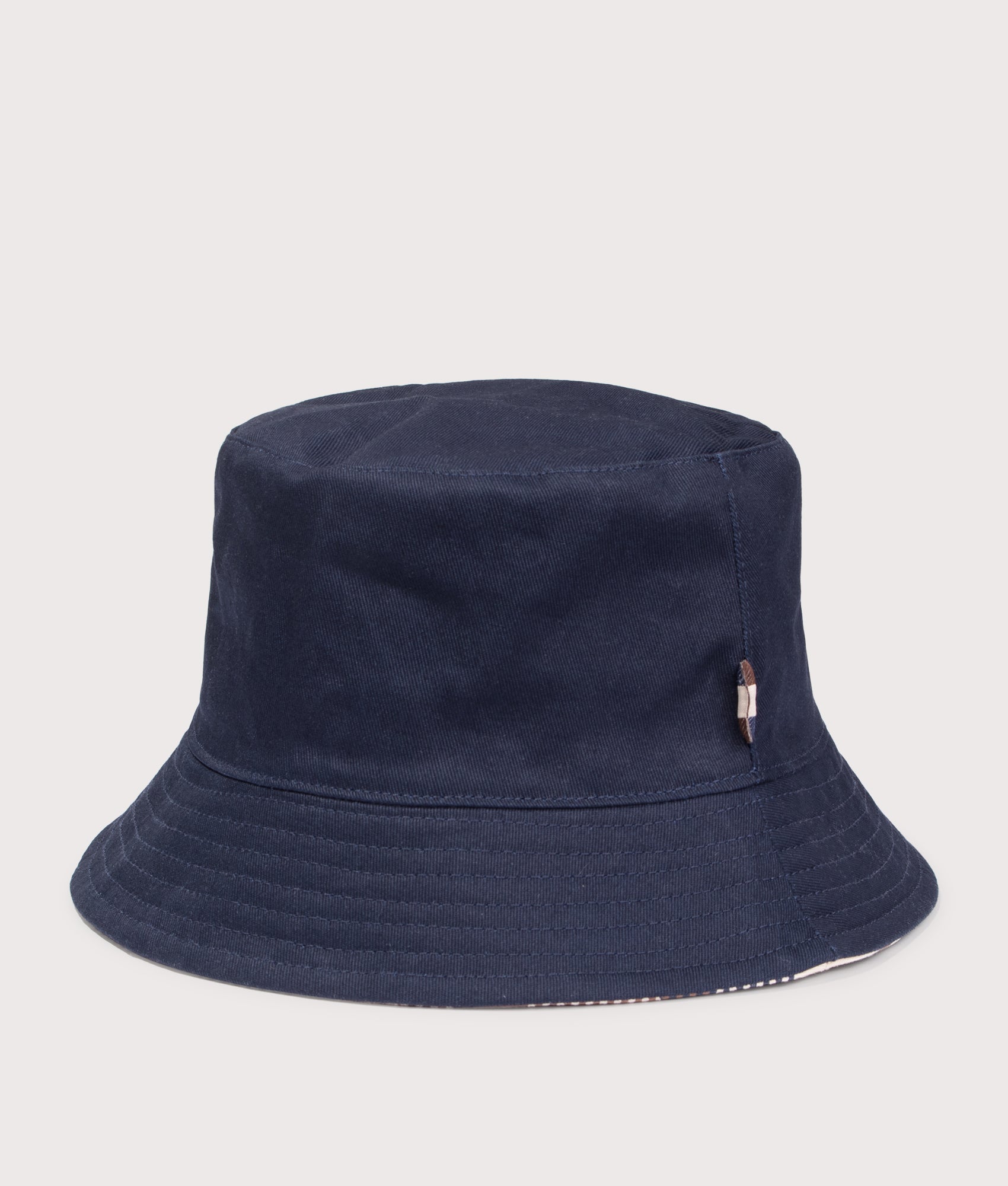 Reversible Club Check Bucket Hat. Shot by EQVVS. Front detail shot.