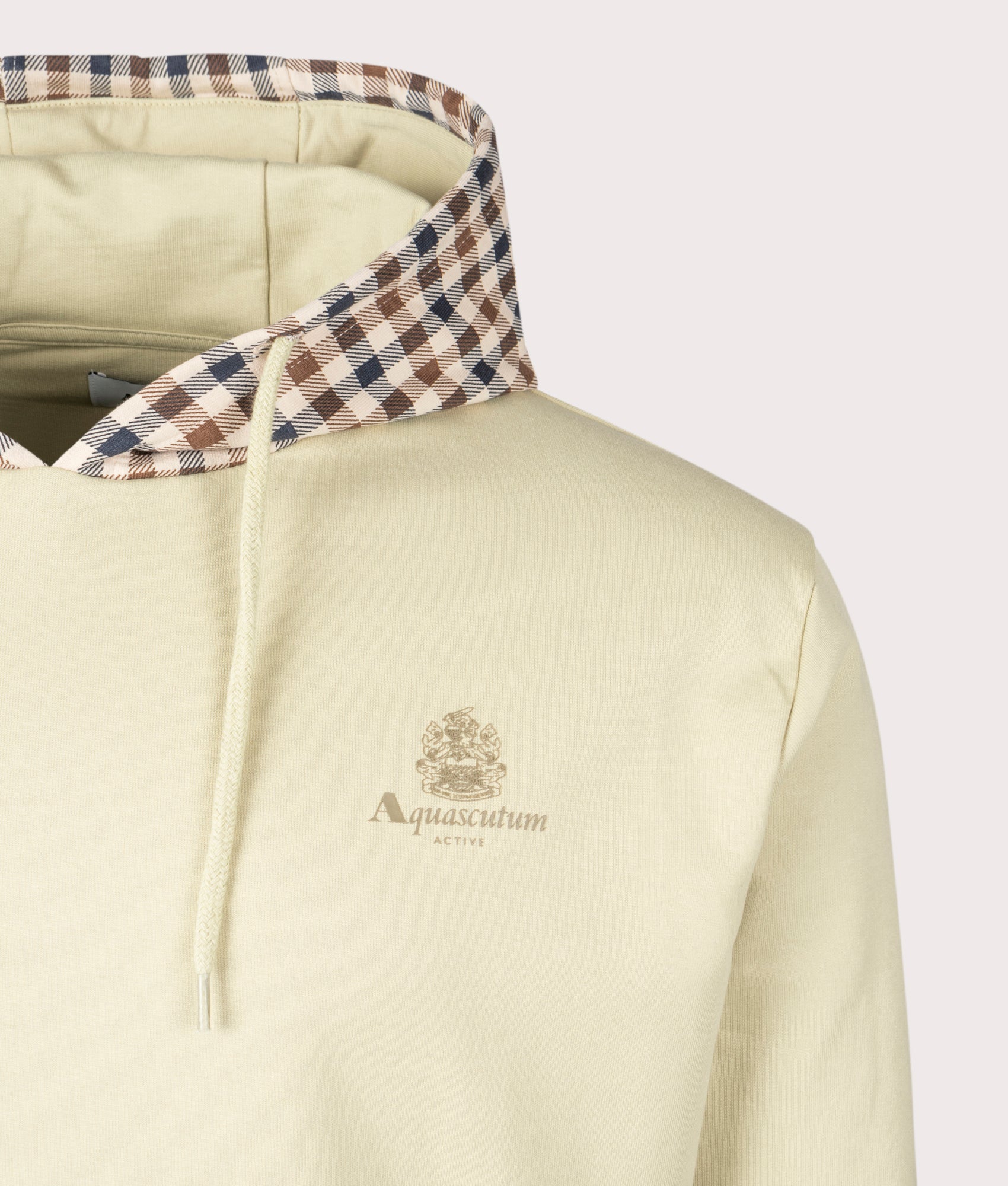 Aquascutum Club Check Hood Overhead Hoodie in Beige, 100% cotton at EQVVS. Detailed logo shot.