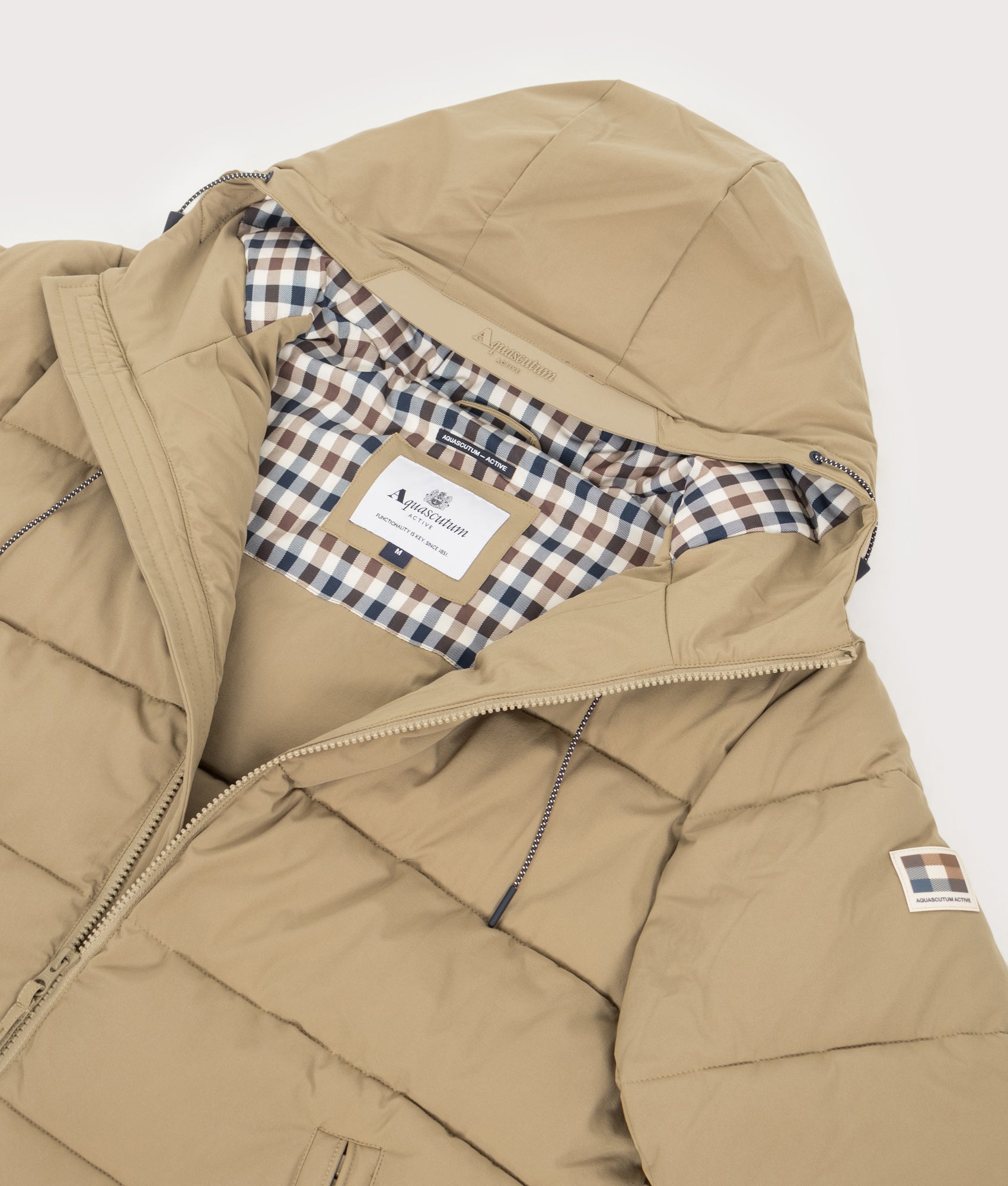 Sp Hooded Pufer Coat by Aquascutum in Khaki. Shot by EQVVS. Internal detail shot.