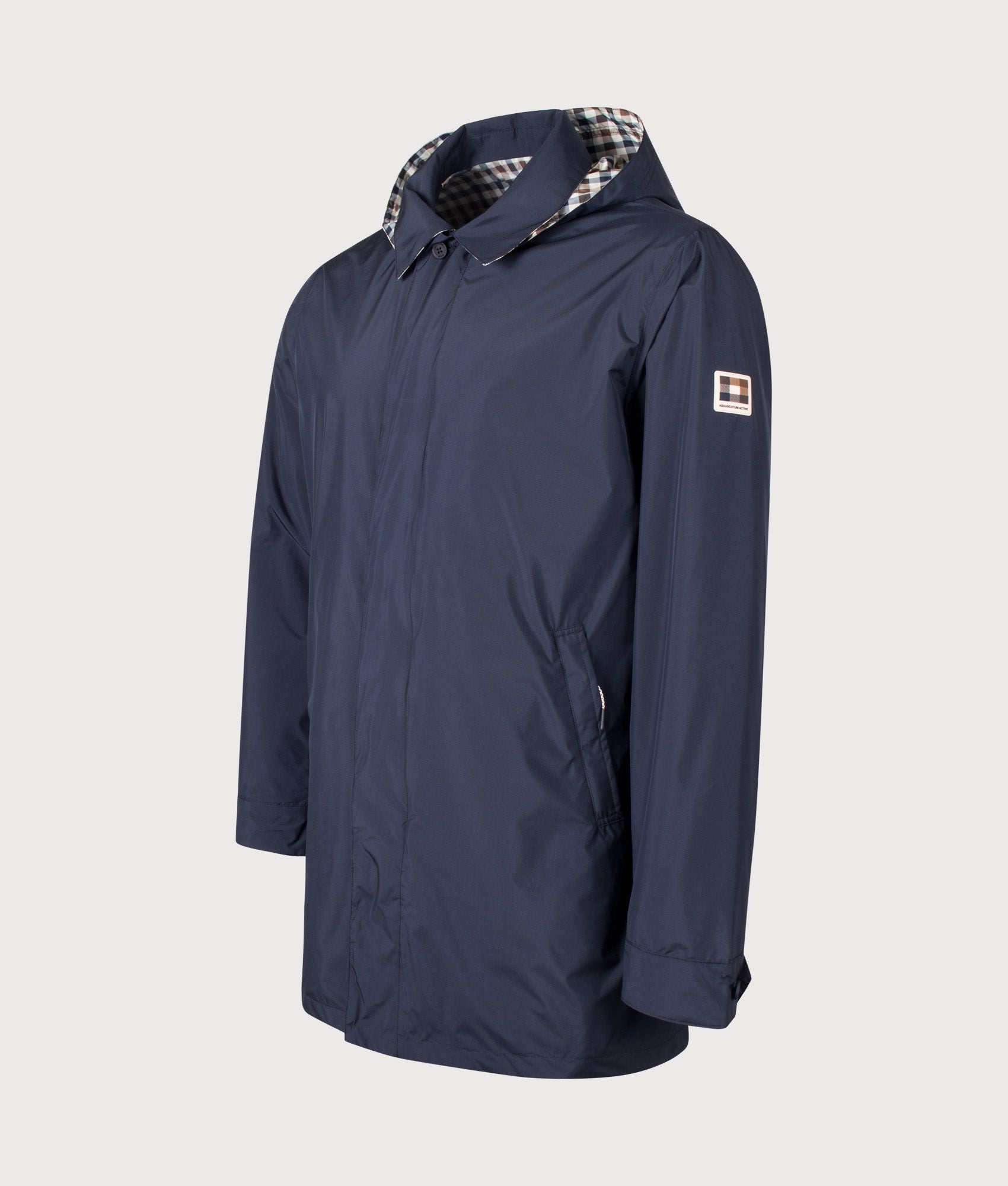 Aquascutum RLG Badge Packable Trench Coat in Navy at EQVVS Menswear. Angled front shot.