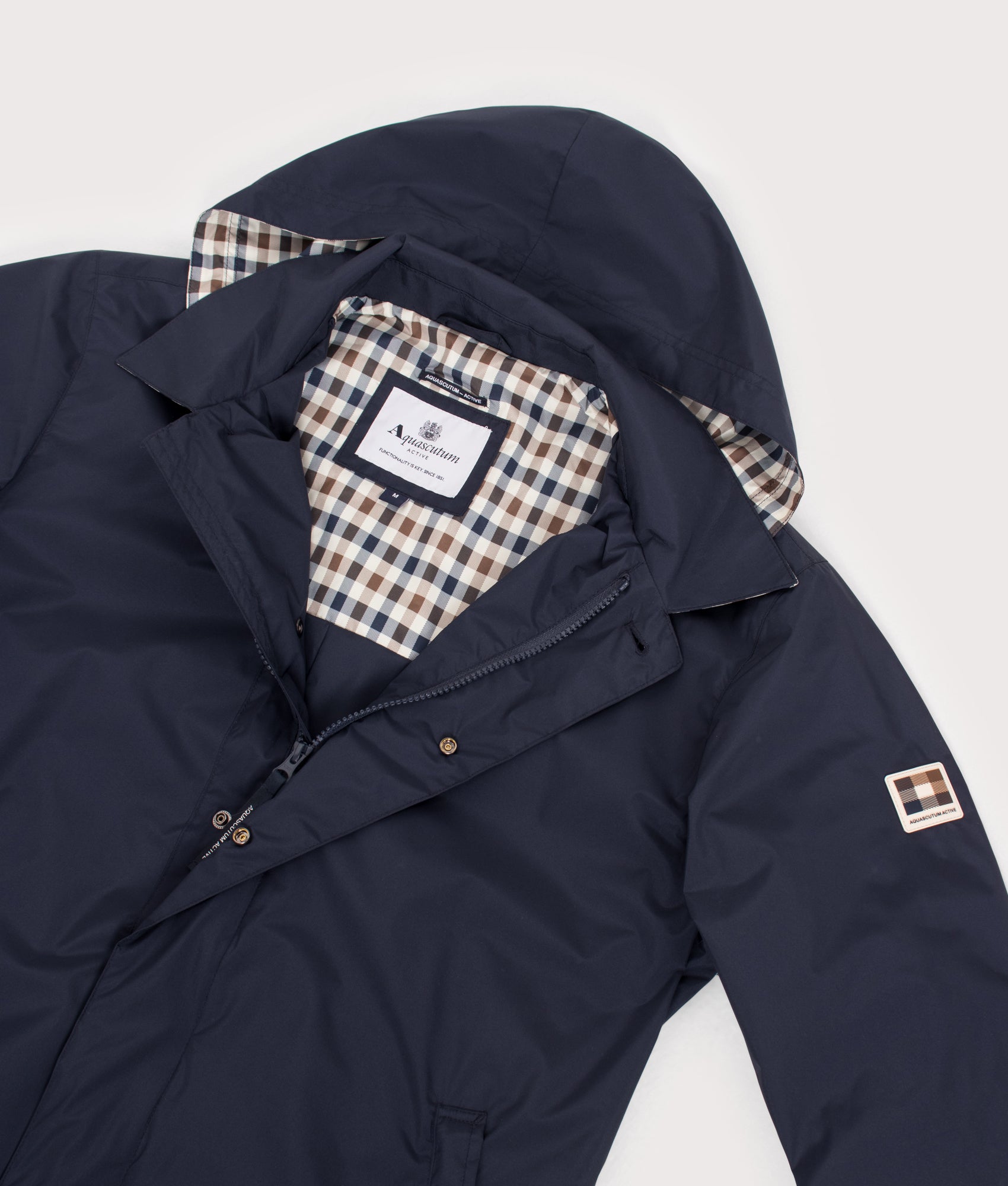 Aquascutum RLG Badge Packable Trench Coat in Navy at EQVVS Menswear. Open hood detail shot.