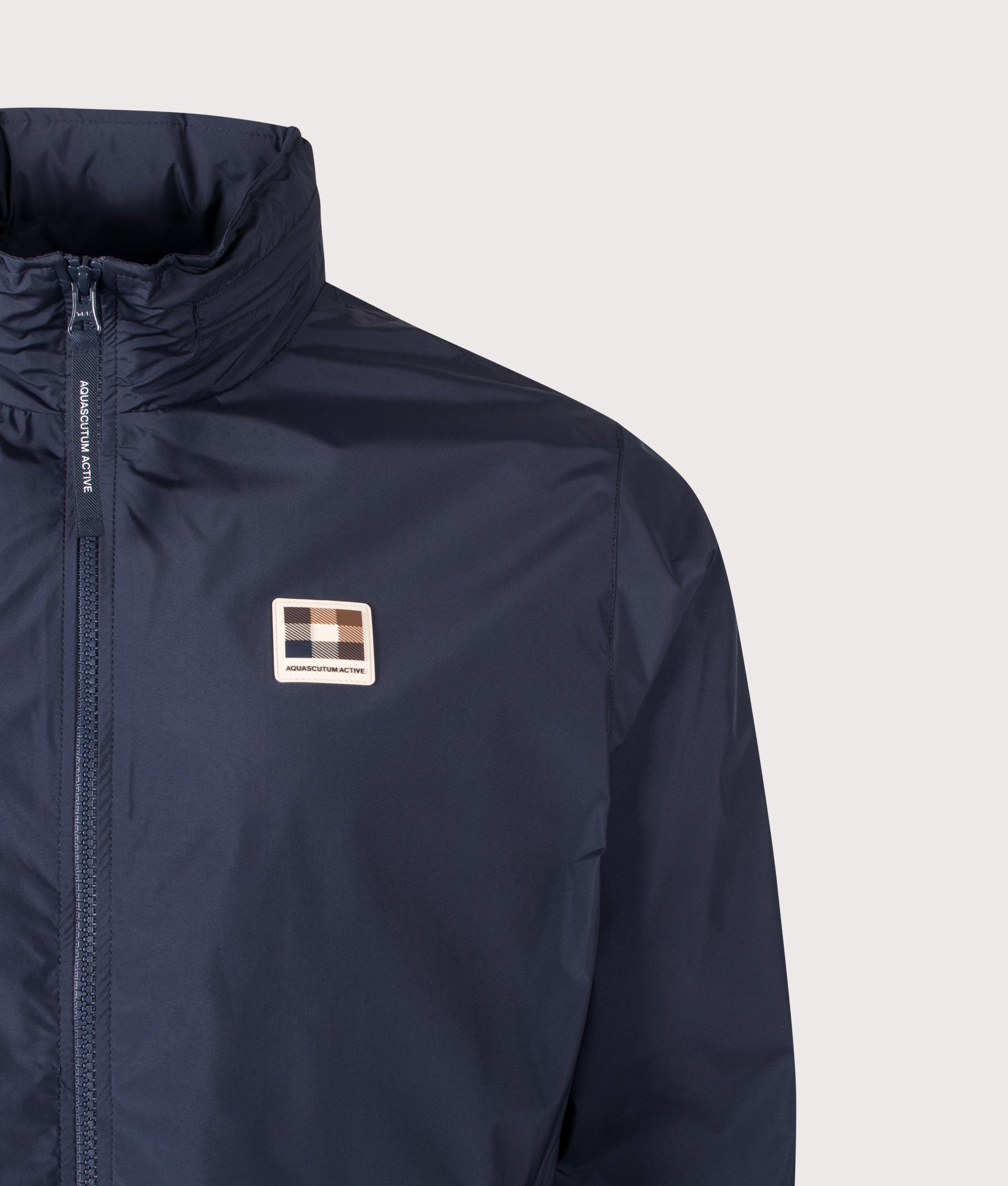 Aquascutum RLG Badge Windbreaker in Navy at EQVVS Menswear. Badge detail shot.