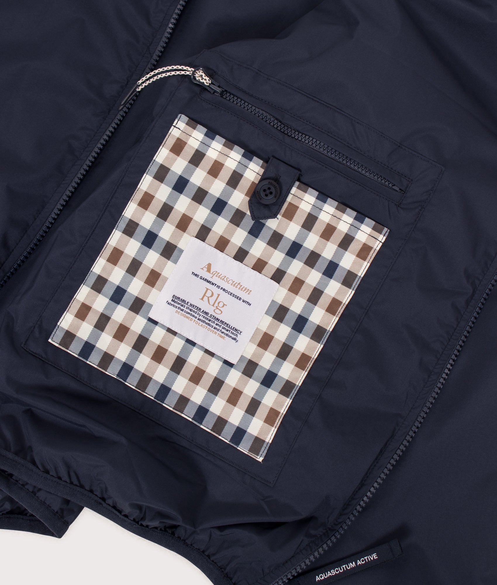 Aquascutum RLG Badge Windbreaker in Navy at EQVVS Menswear. Internal detail shot.