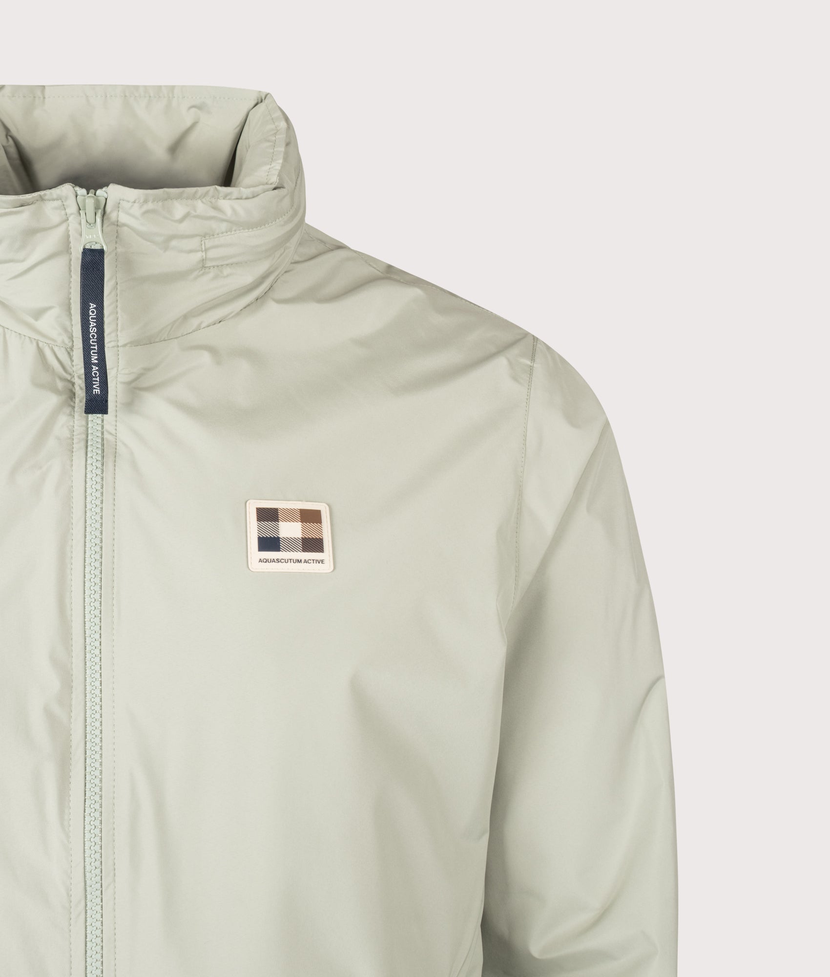 Aquascutum RLG Badge Windbreaker  in Salvia at EQVVS Menswear. Badge detail shot.