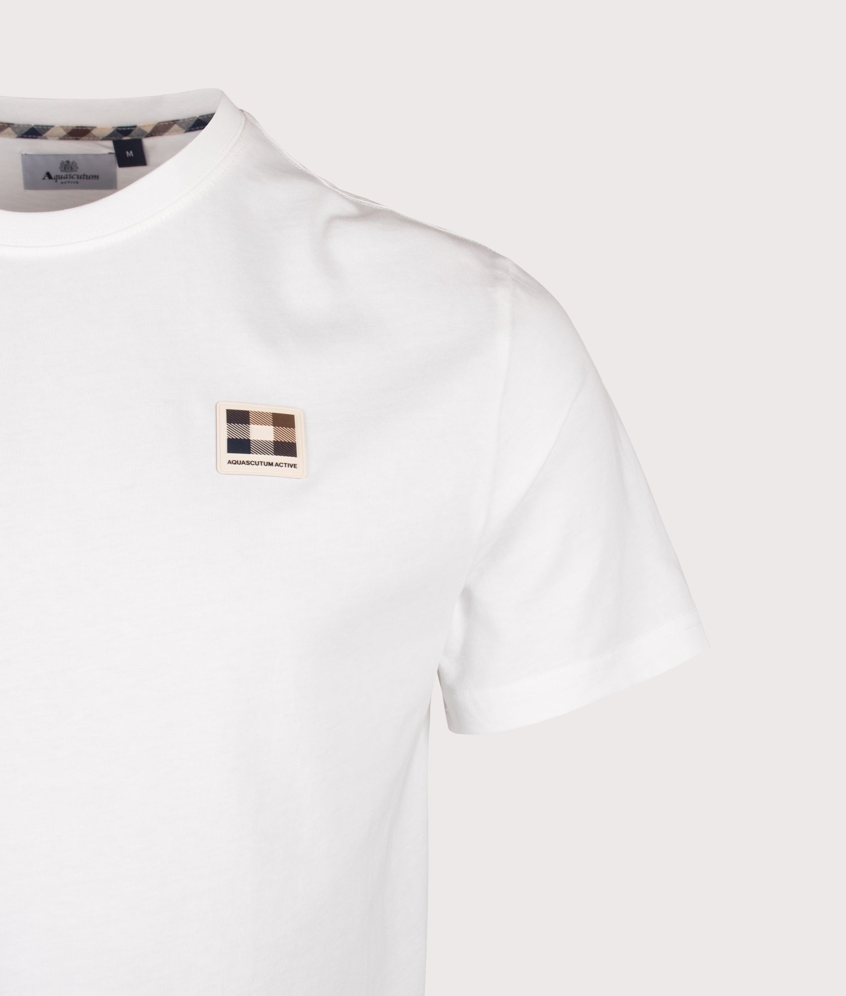 Aquascutum Badge T-Shirt in Old White at EQVVS Menswear. Detail shot.