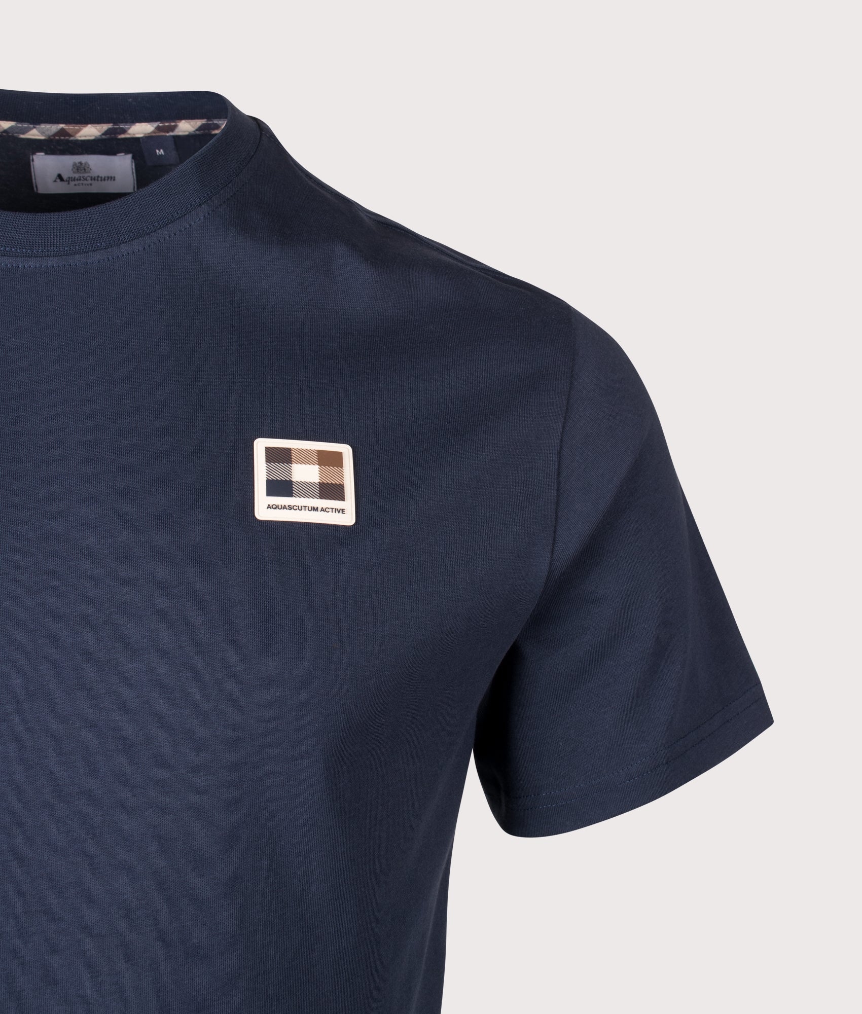 Aquascutum Badge T-Shirt in Navy at EQVVS Menswear. Detail shot.