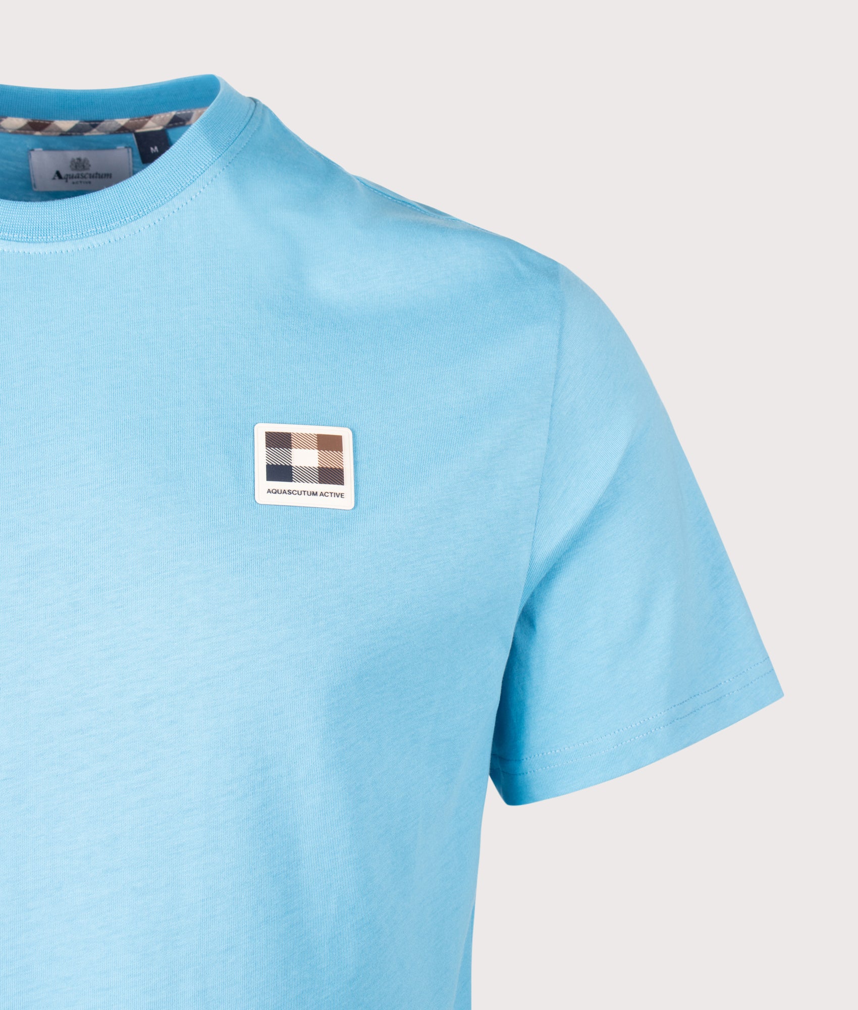 Aquascutum Badge T-Shirt in Avio at EQVVS Menswear. Detail Shot.