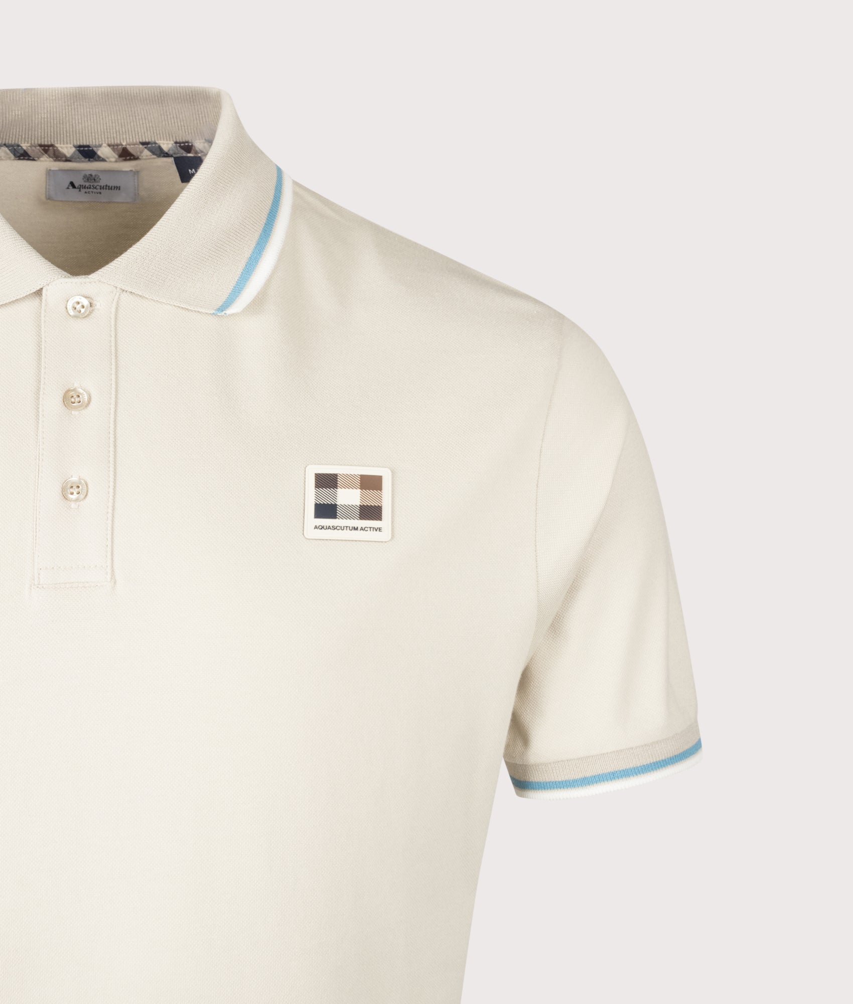 Aquascutum Stretch Piquet Stripes Polo Shirt in Beige at EQVVS Menswear. Detail shot.
