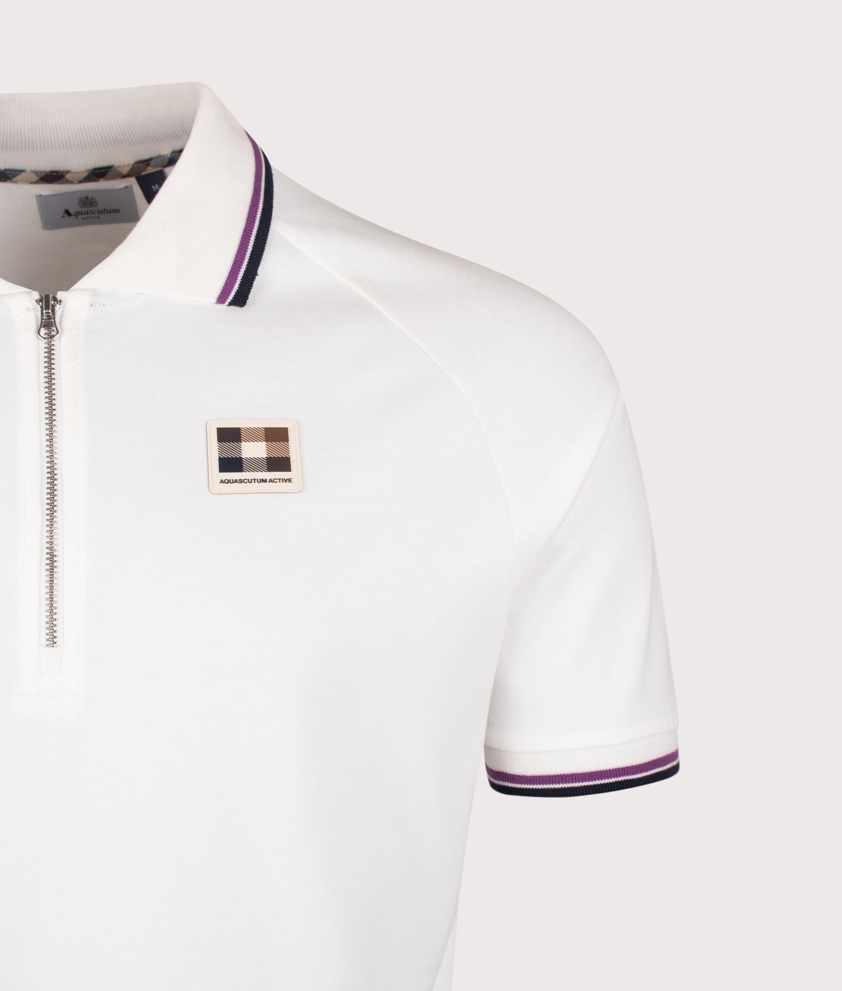 Aquascutum Stretch Piquet Quarter Zip Polo Shirt in Old White at EQVVS Menswear. Detail shot.