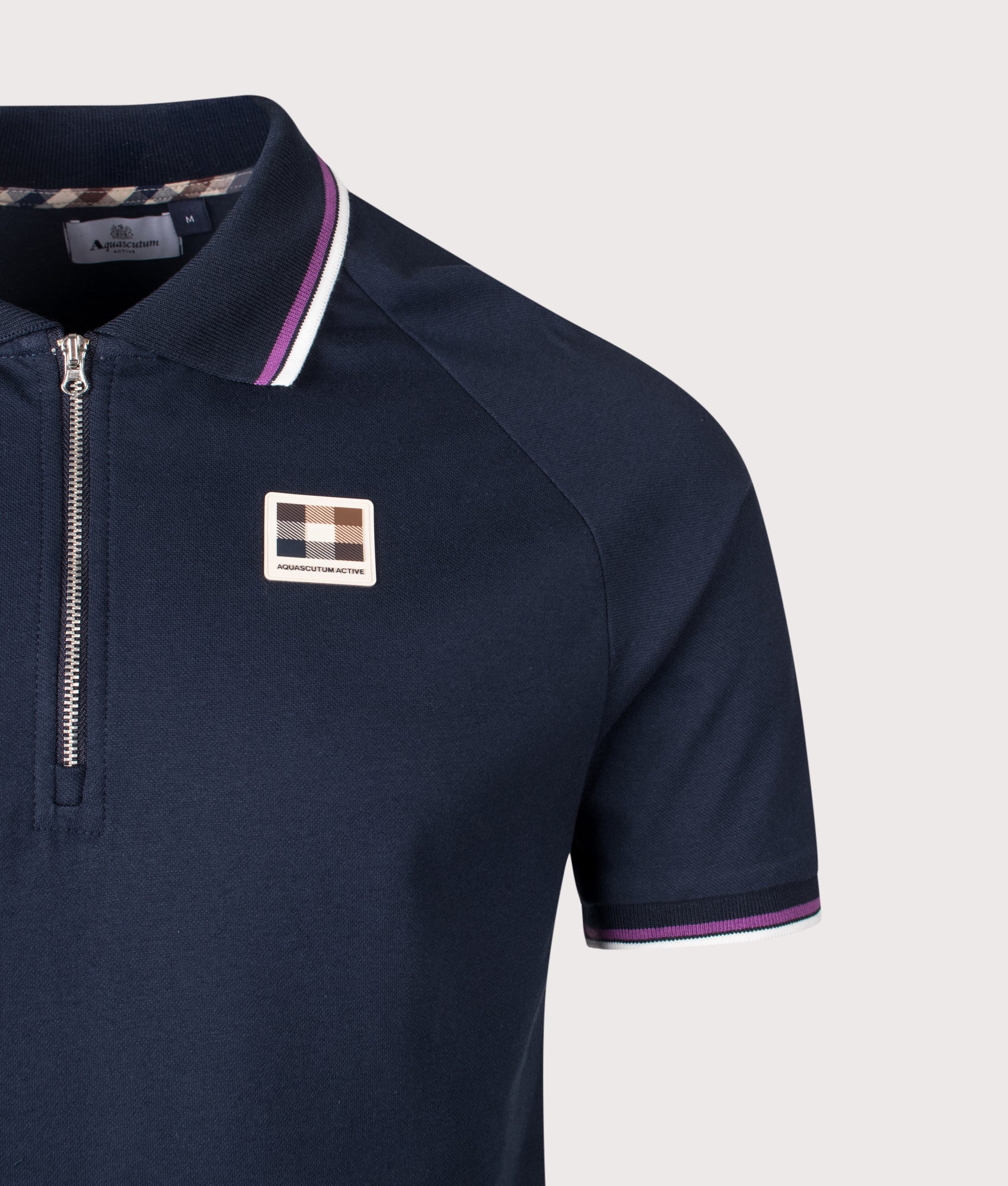 Aquascutum Stretch Piquet Quarter Zip Polo Shirt in Navy at EQVVS Menswear. Detail shot.