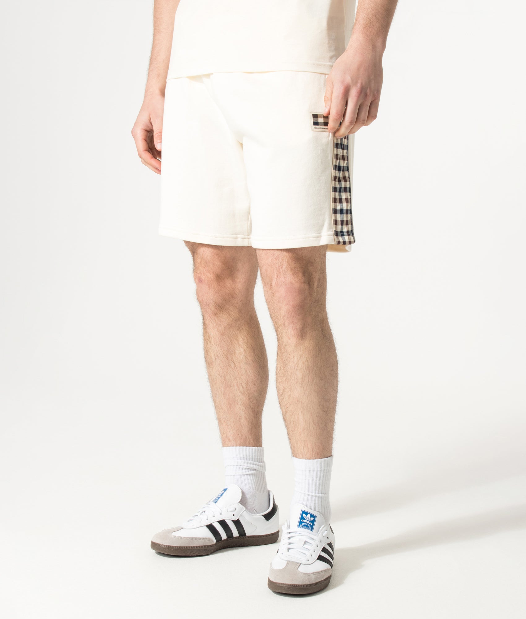 Aquascutum Lamina Insert Sweat Shorts in Old White at EQVVS Menswear. Model front shot.