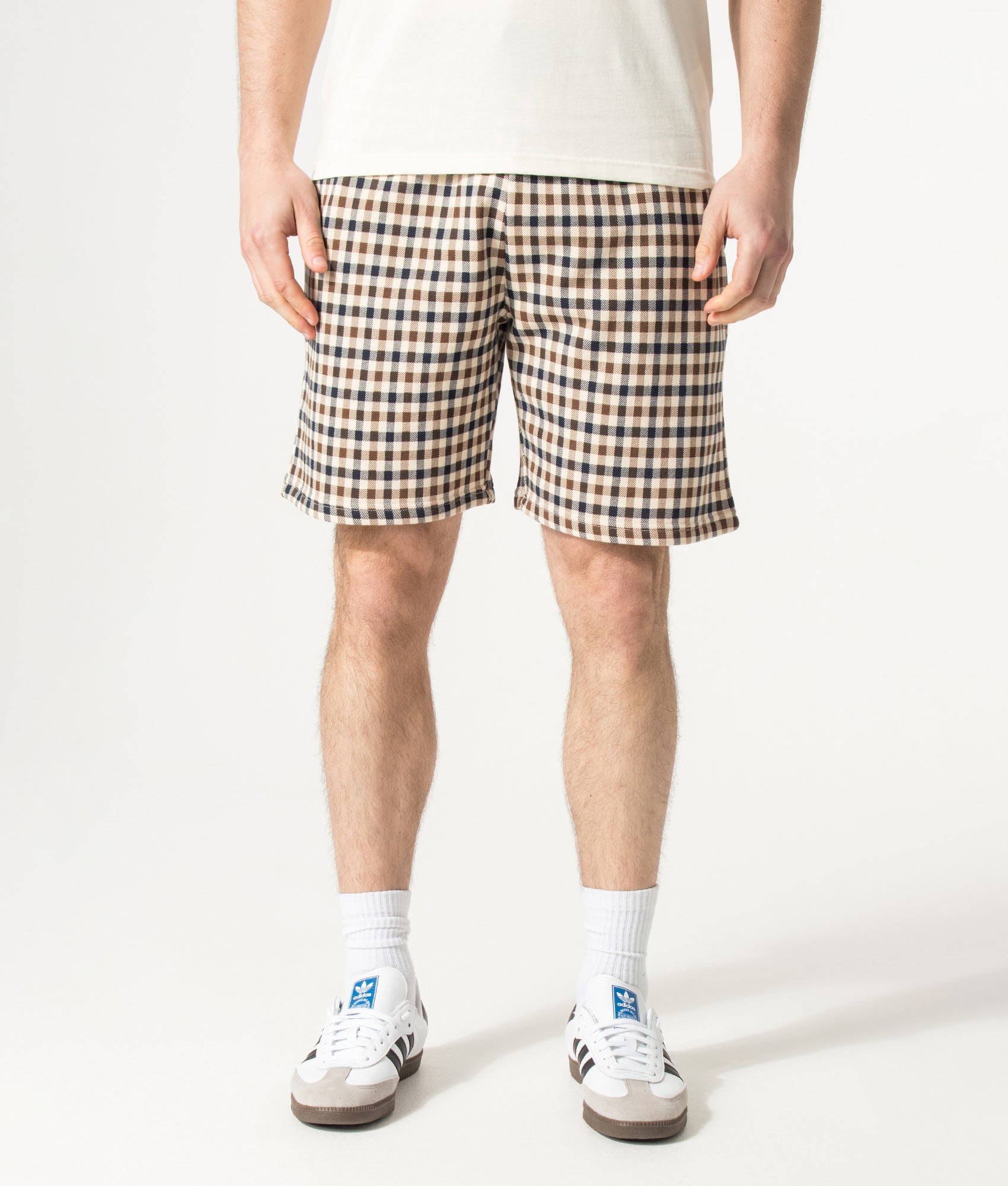 Aquascutum Club Check Sweat Shorts in Navy and Club Check at EQVVS Menswear. Model front shot.