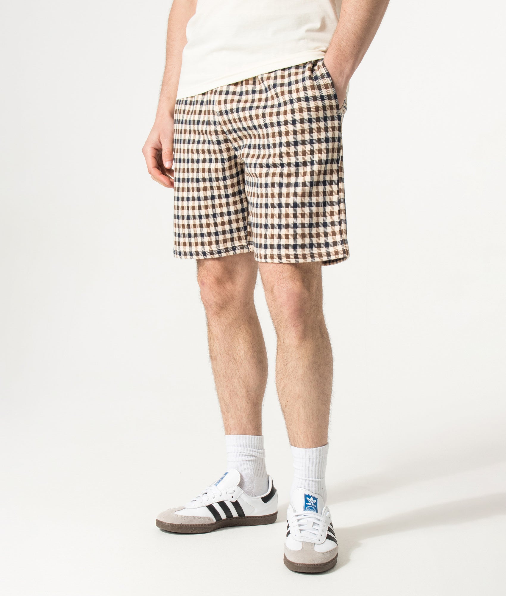 Aquascutum Club Check Sweat Shorts in Navy and Club Check at EQVVS Menswear. Model front shot.
