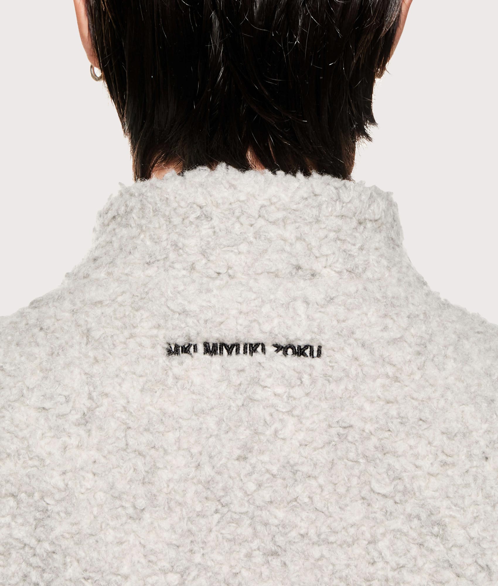 MKI MIYUKI ZOKU Wool Fleece Track Jacket in Oatmeal at EQVVS Menswear. Detail shot.