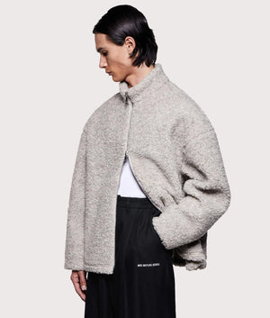 MKI MIYUKI ZOKU Wool Fleece Track Jacket in Oatmeal at EQVVS Menswear. Angled model front shot.