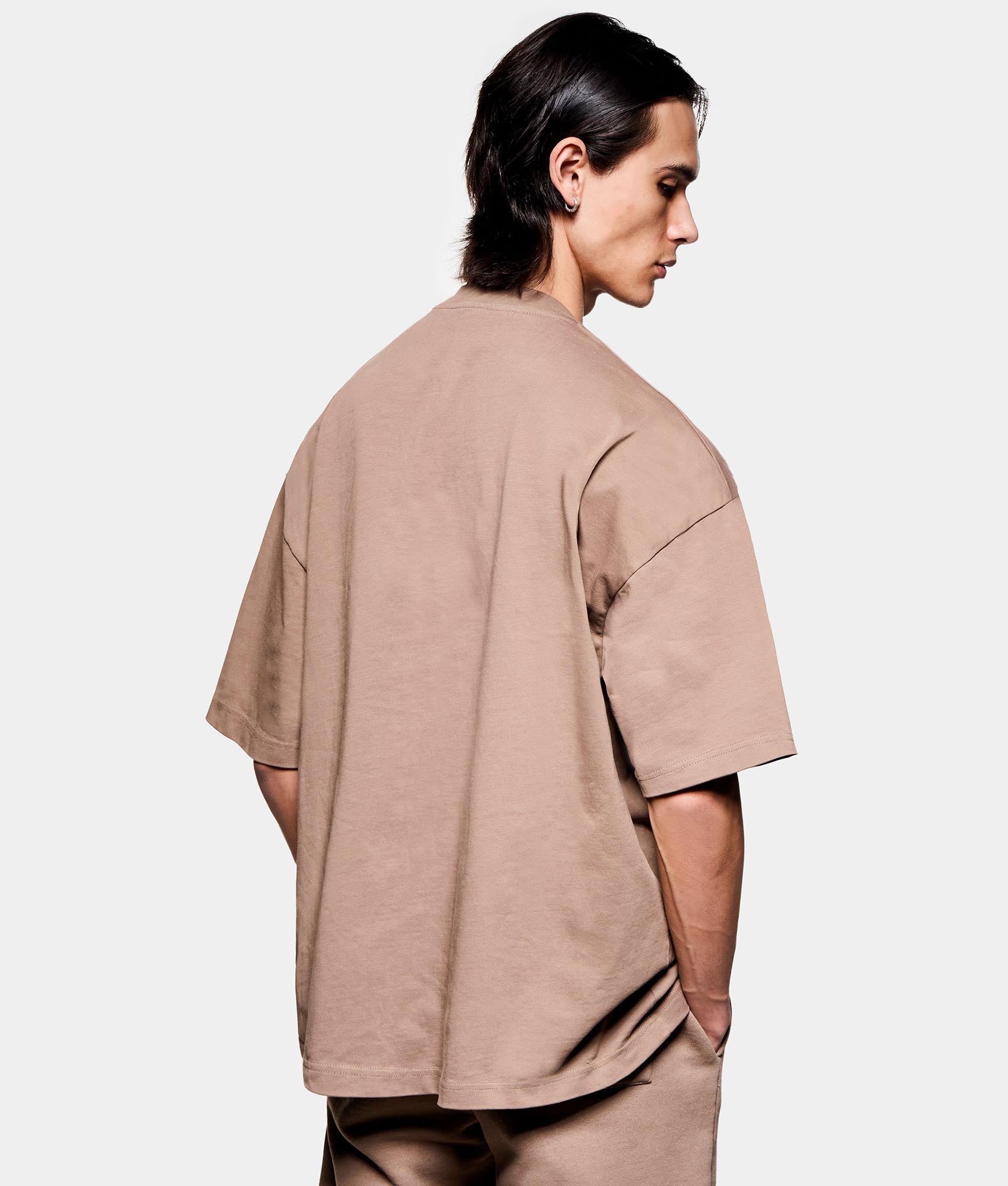 Uniform T-Shirt. Back angled model shot by EQVVS.