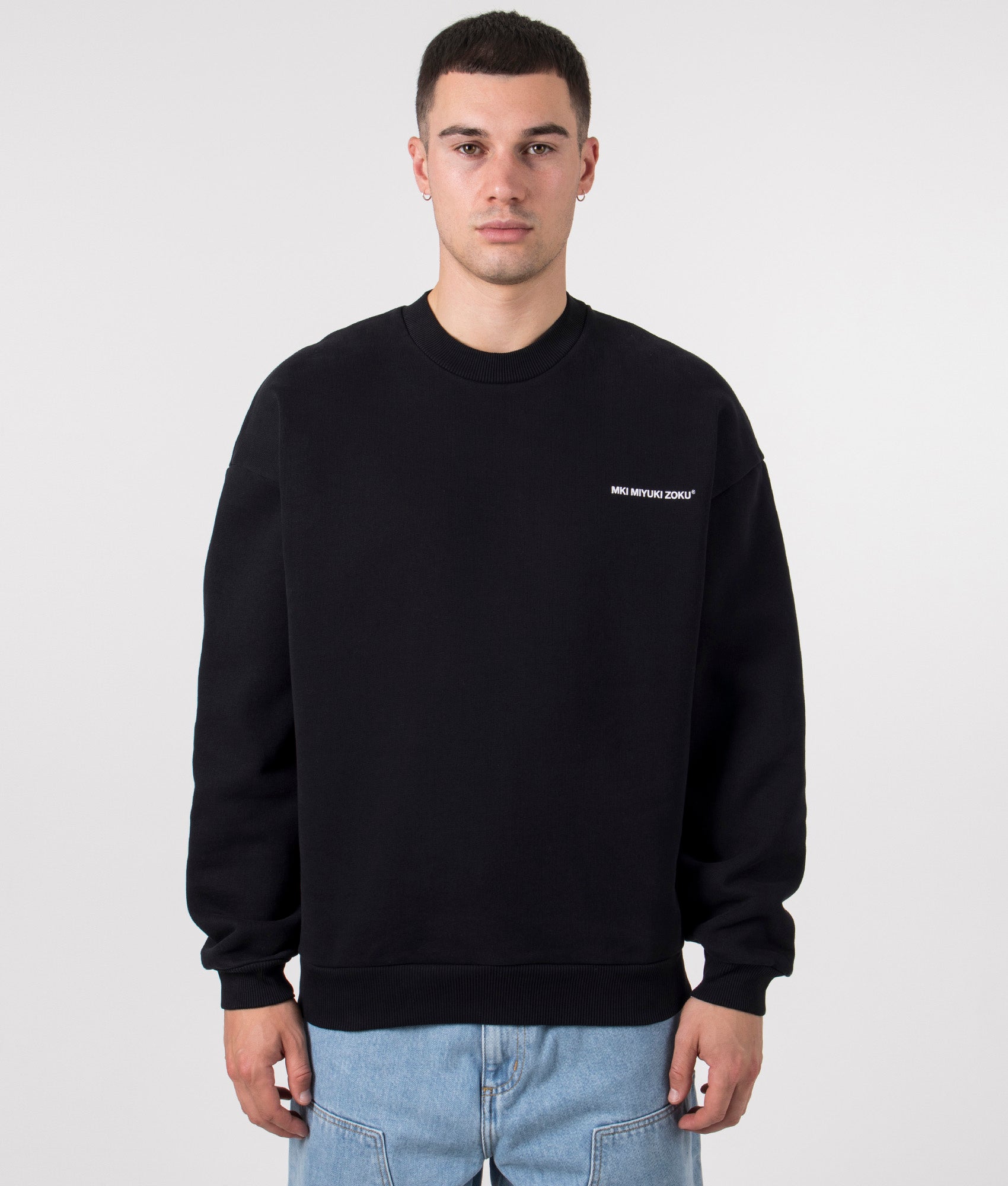 MKI MIYUKI ZOKU Oversized Uniform Crewneck Sweatshirt in Black at EQVVS Menswear. Model front Shot. 