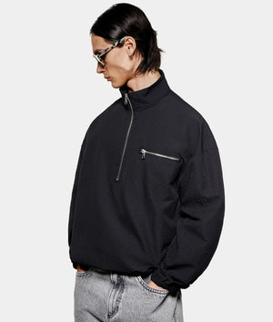 Seersucker Quarter Zip Sweatshirt. Front model angled shot by EQVVS.