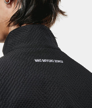 Seersucker Quarter Zip Sweatshirt. Back model detail shot by EQVVS.