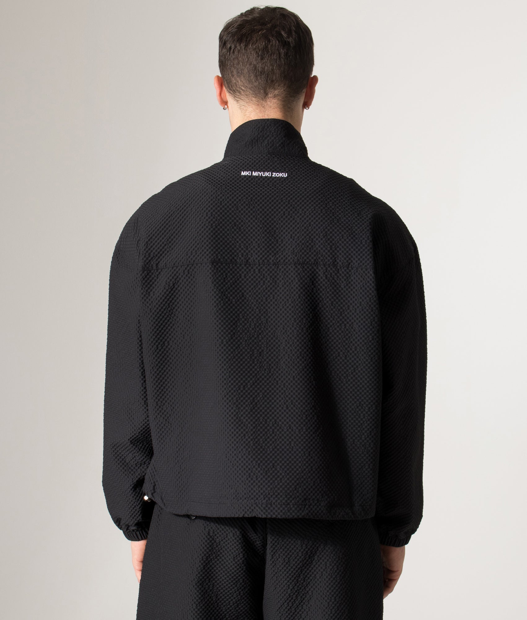 Seersucker Quarter Zip Sweatshirt in Black | MKI MIYUKI ZOKU | Shot at EQVVS | Back model shot 