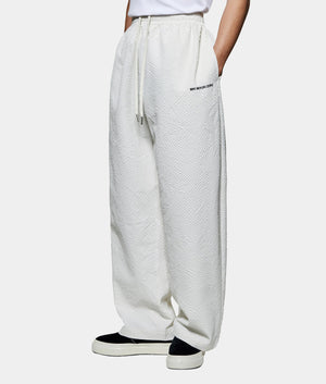 Seercucker Wide Leg Trousers. Side angled model shot by EQVVS.