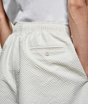 Seercucker Wide Leg Trousers. Back model detail shot by EQVVS.