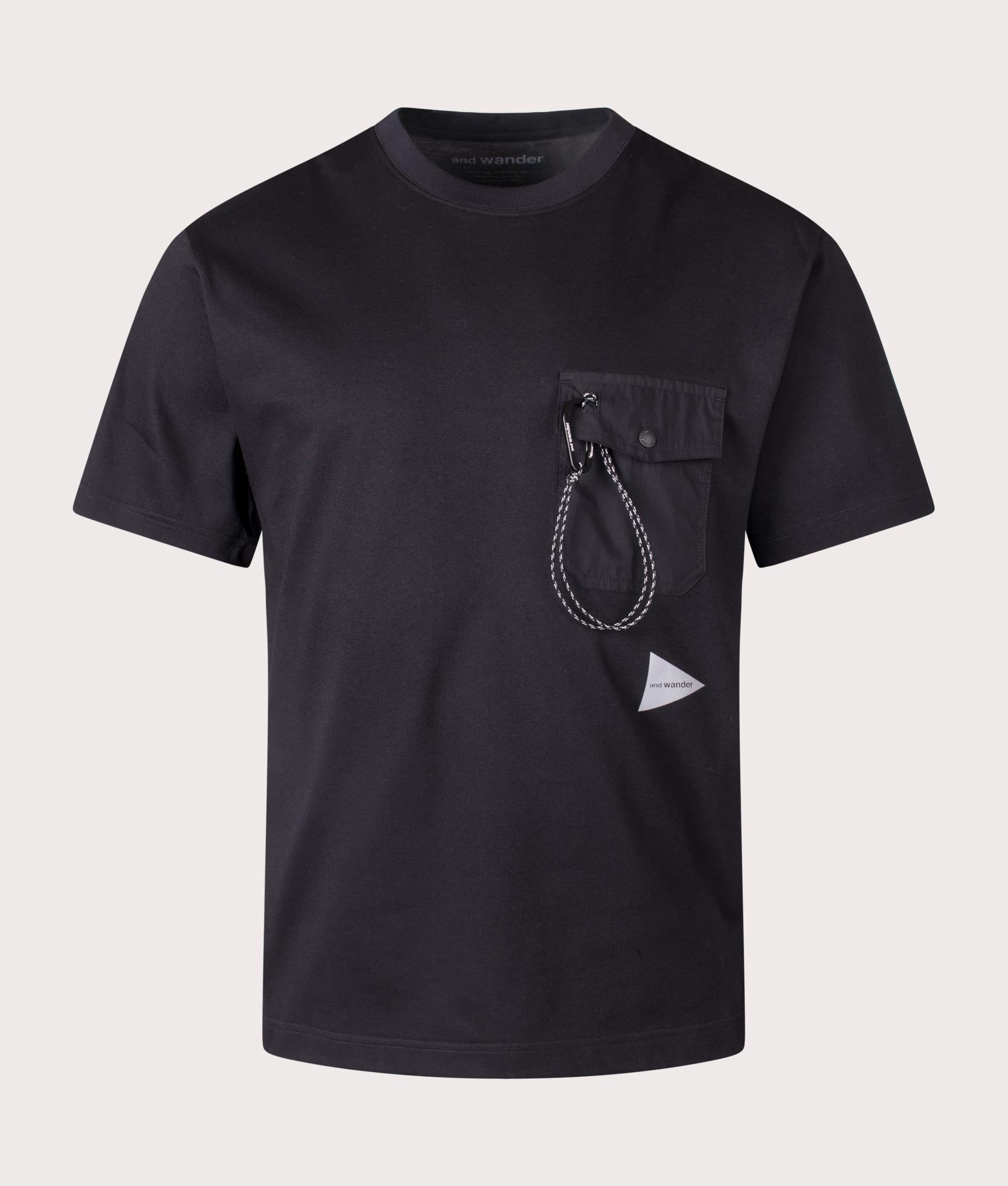and wander Pocket T-Shirt in Black. Shot at EQVVS.  Front detail shot 