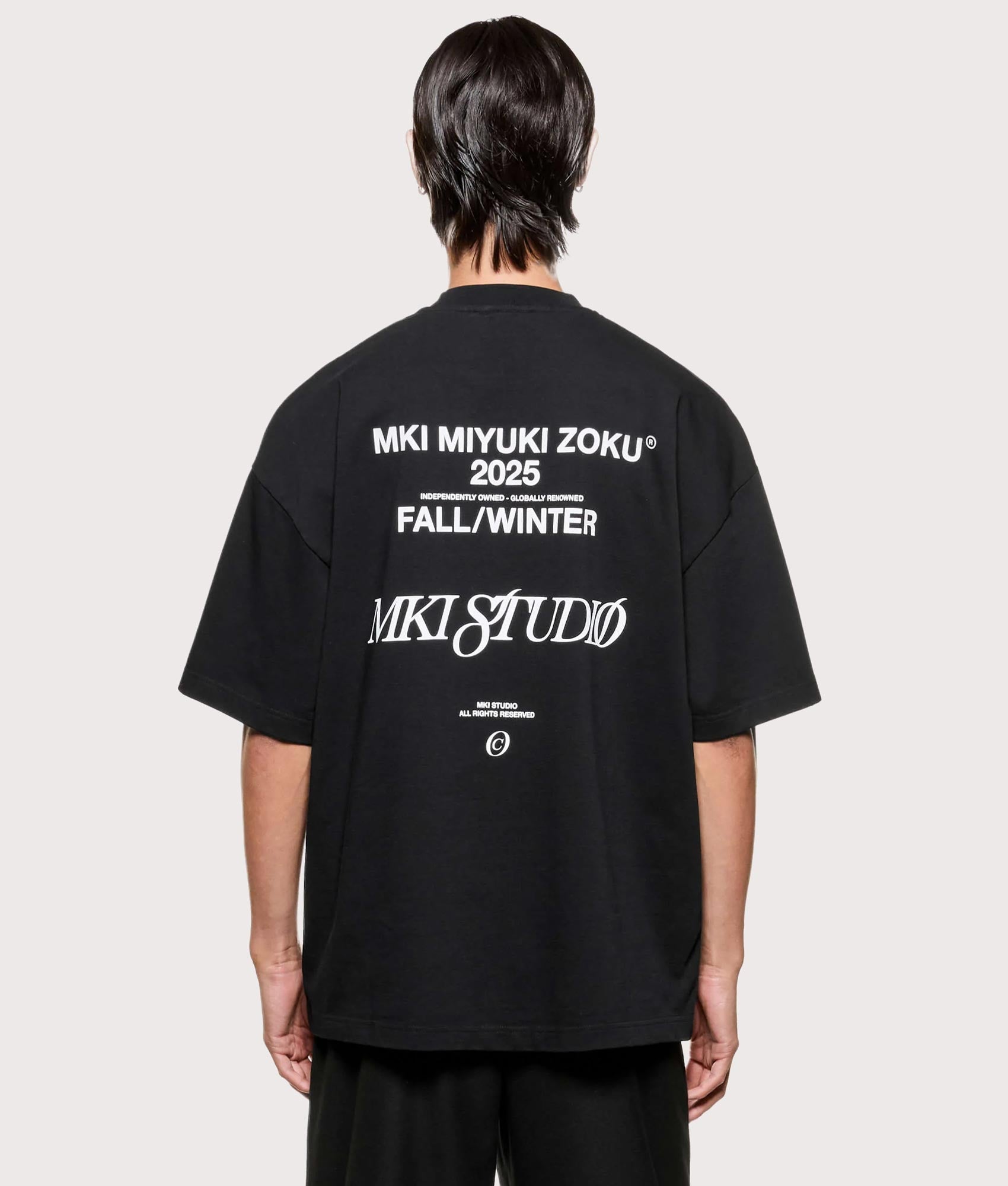 MKI MIYUKI ZOKU Script T shirt in Black at EQVVS Menswear. Back shot.