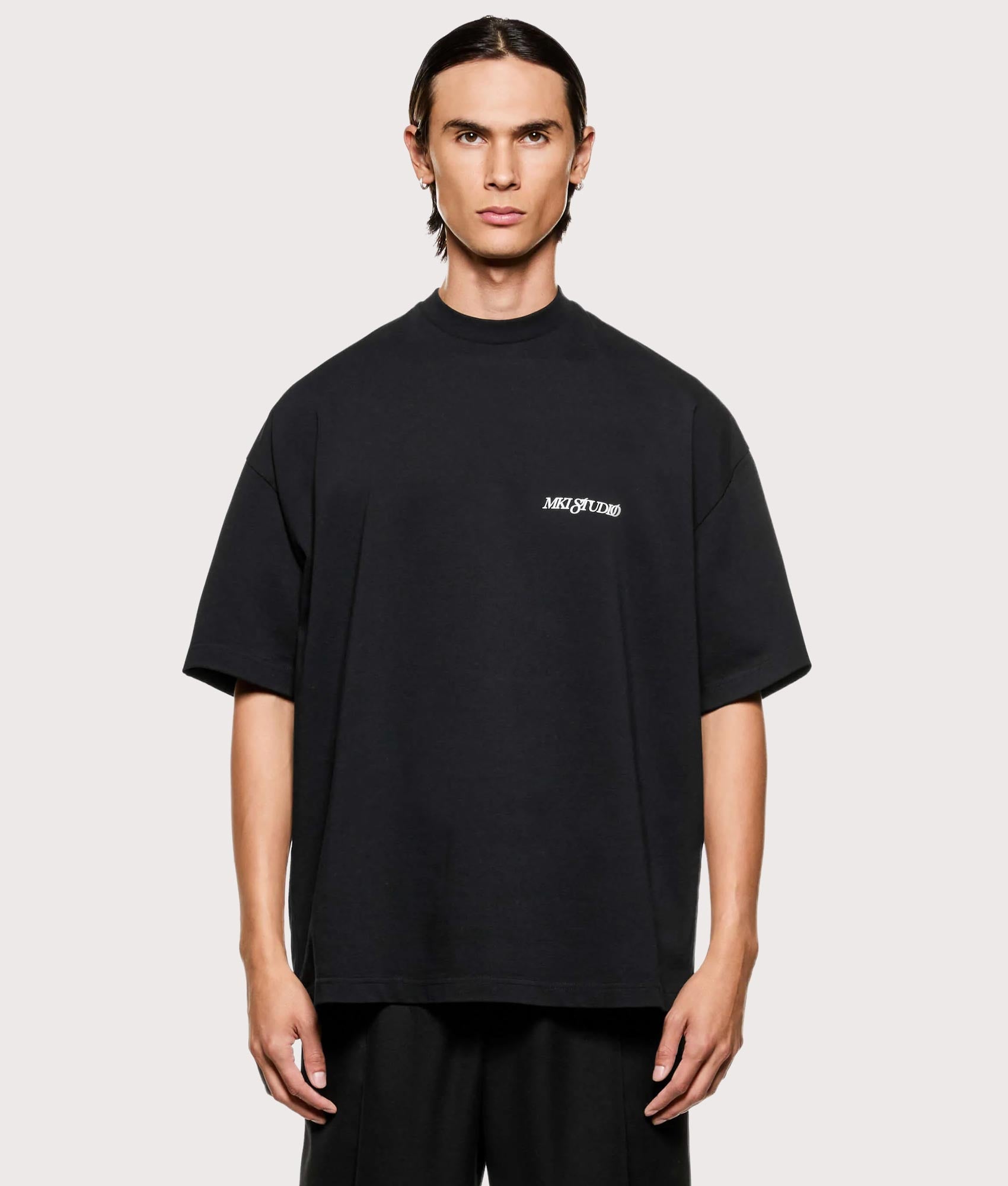 MKI MIYUKI ZOKU Script T shirt in Black at EQVVS Menswear. Front shot.