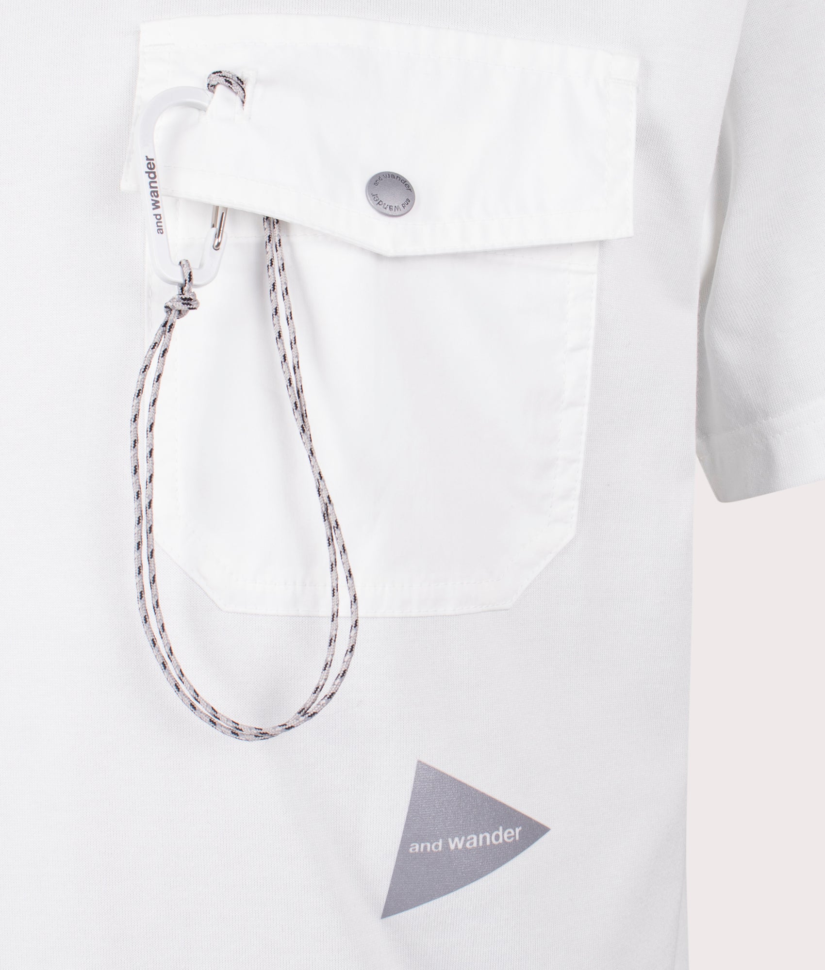 and wander Pocket T-Shirt in Off White . Shot at EQVVS. Front logo shot 