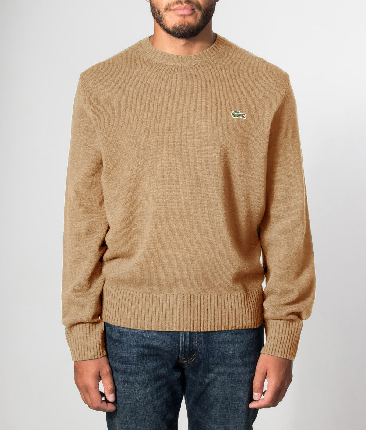 Lacoste Classic Fit Wool Crewneck Jumper in Cookie at EQVVS Menswear. Front model shot.