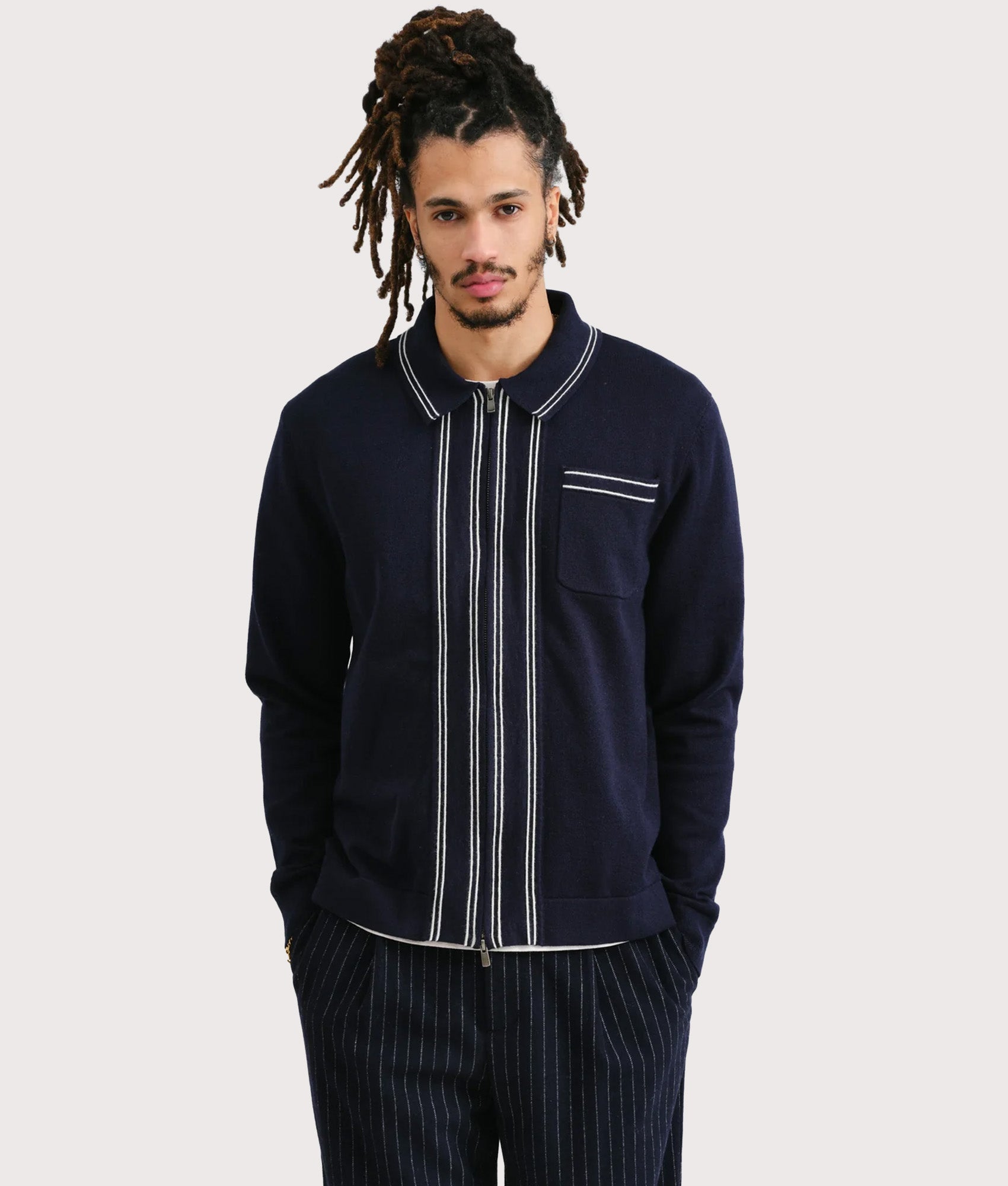 Wax London Amble Polo Shirt in Navy at EQVVS Menswear. Model Front shot.