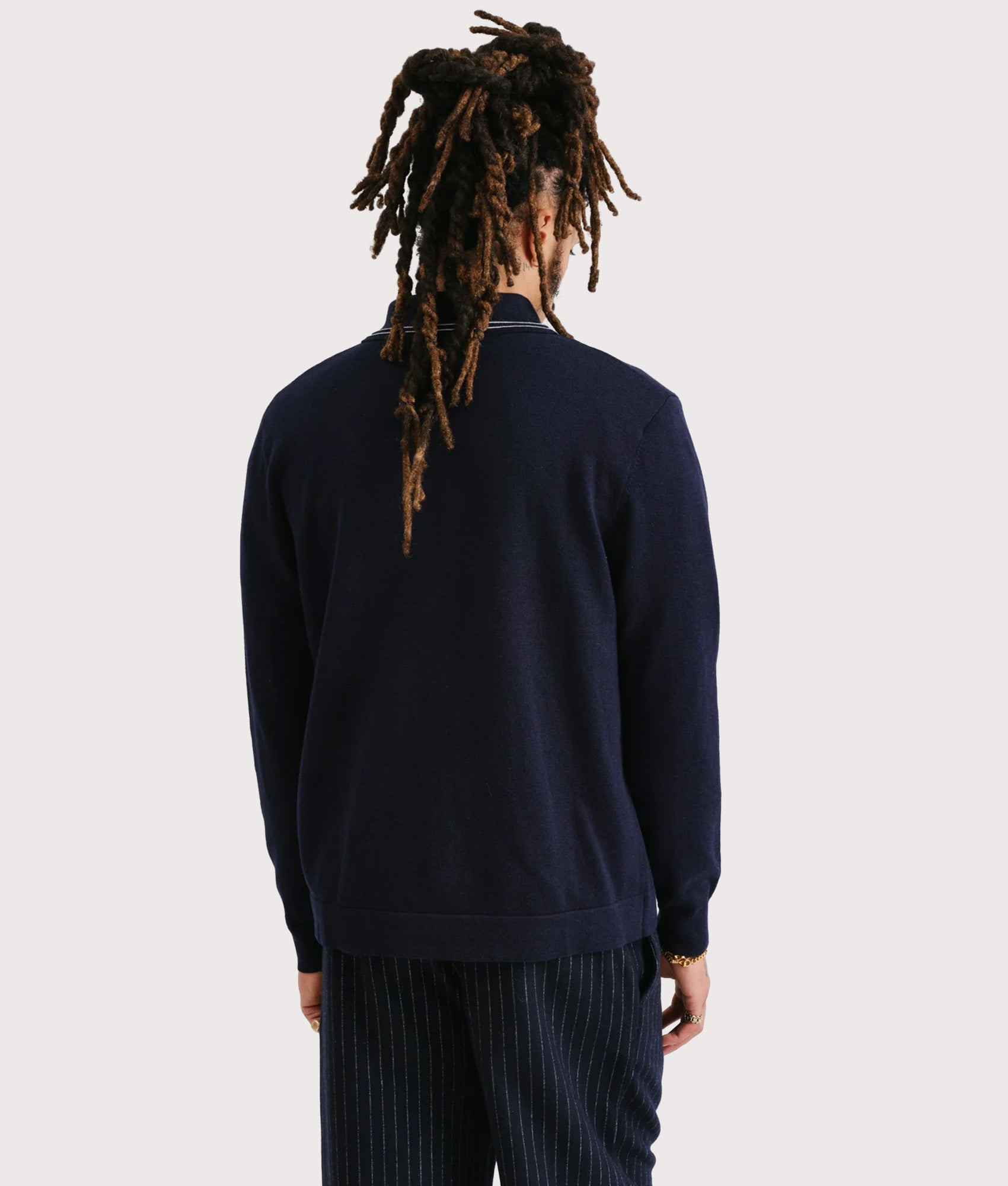 Wax London Amble Polo Shirt in Navy at EQVVS Menswear. Model Back shot.
