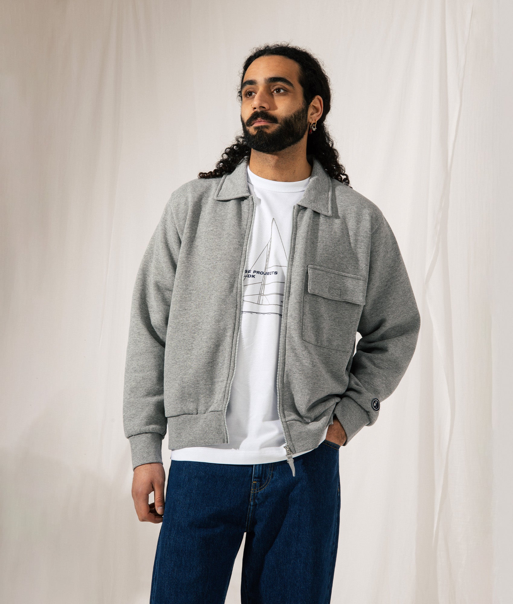 Universal Works Tyler Jacket in Grey Marl. Shot at EQVVS.  Model campaign shot. 