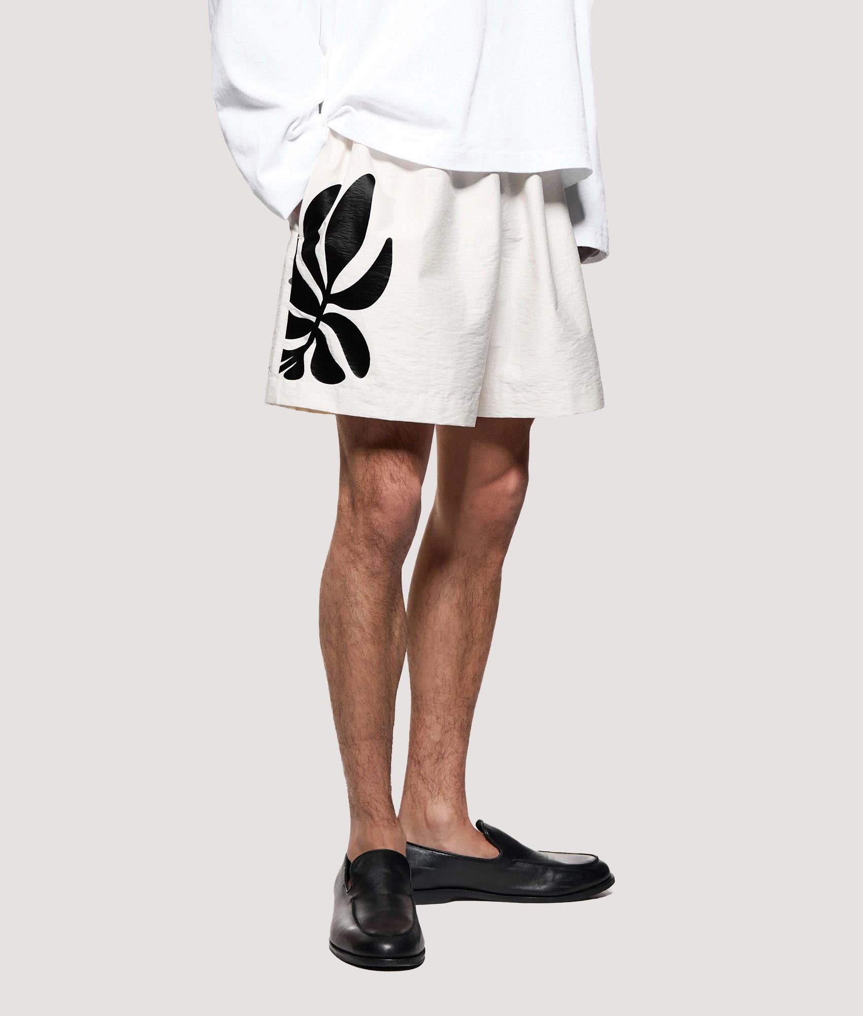 MKI MIYUKI ZOKU Relaxed Fit Botanical Print Wide Leg ShortS in Bone at EQVVS Menswear. Mode angled front shot.