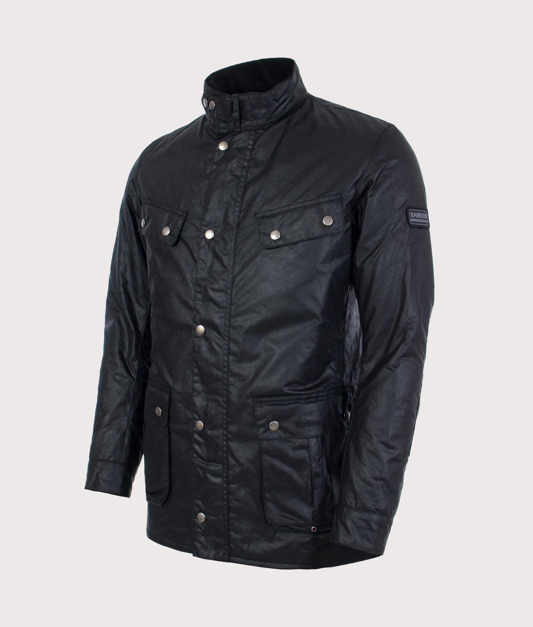 Barbour International Intl. Duke Wax Jacket in Black at EQVVS Menswear. Angled front shot.