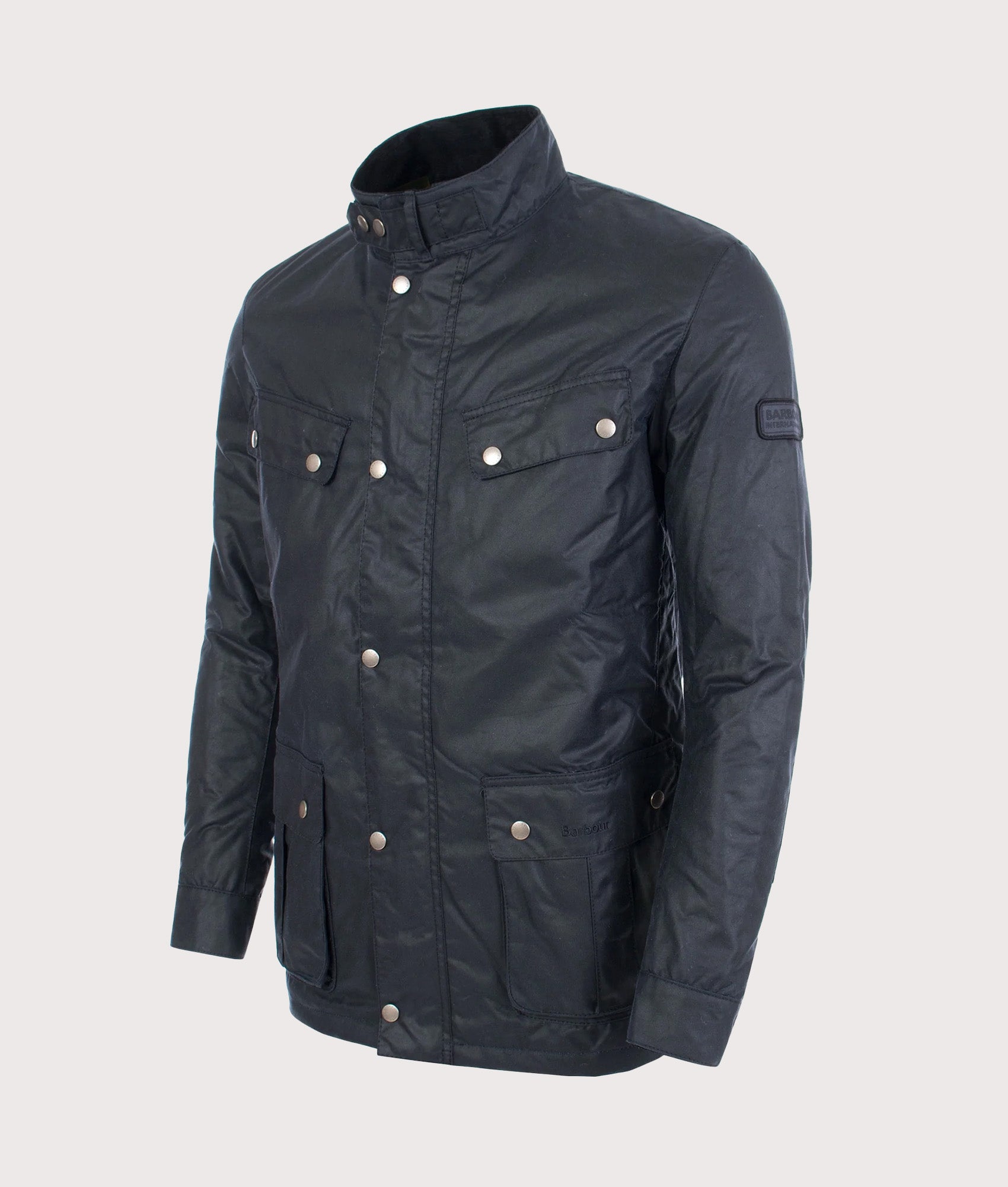 Barbour Intl. Duke Wax Jacket in Navy at EQVVS Menswear. Angled front shot.