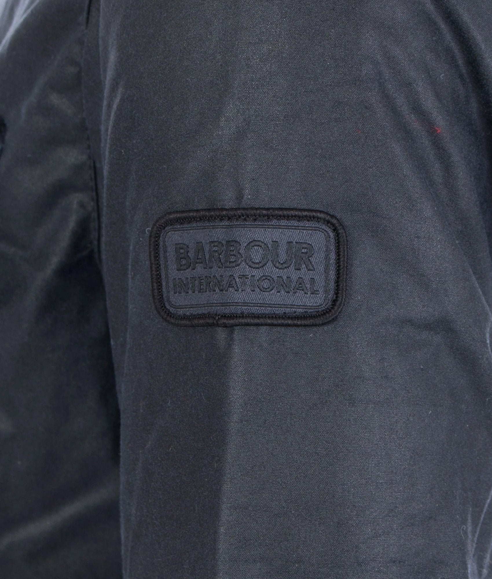 Barbour Intl. Duke Wax Jacket in Navy at EQVVS Menswear. Detail shot.