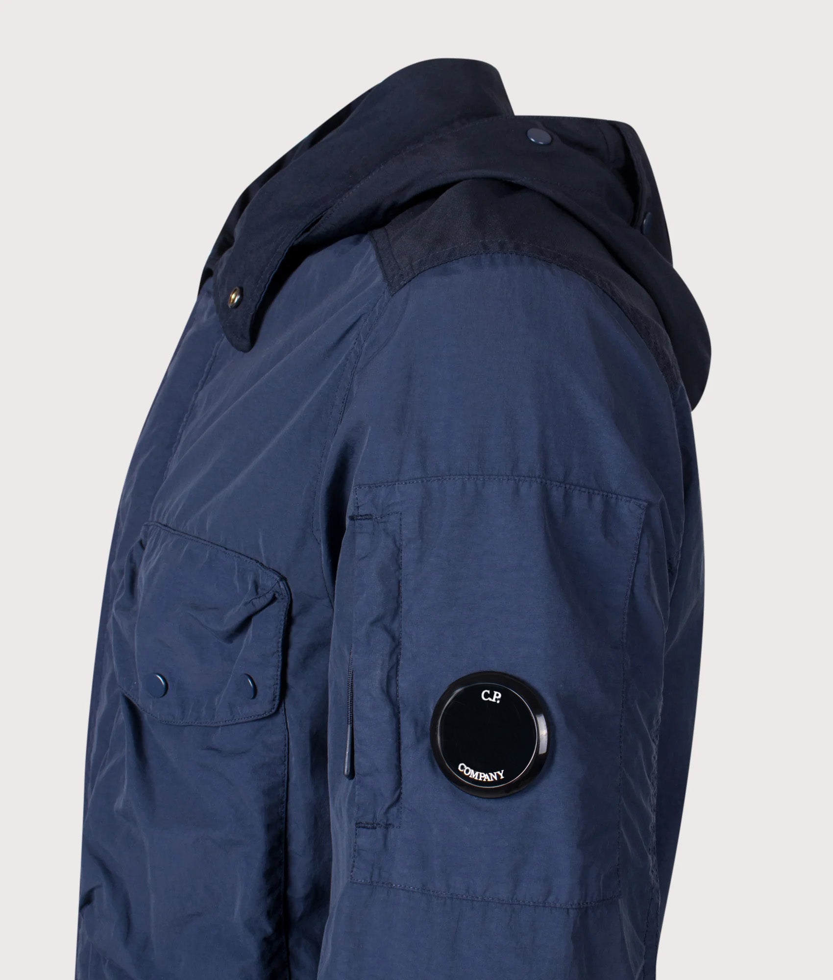 C.P. Company Flatt Nylon Mixed Goggle Overshirt in Midnight Navy at EQVVS Menswear. Side detail shot.