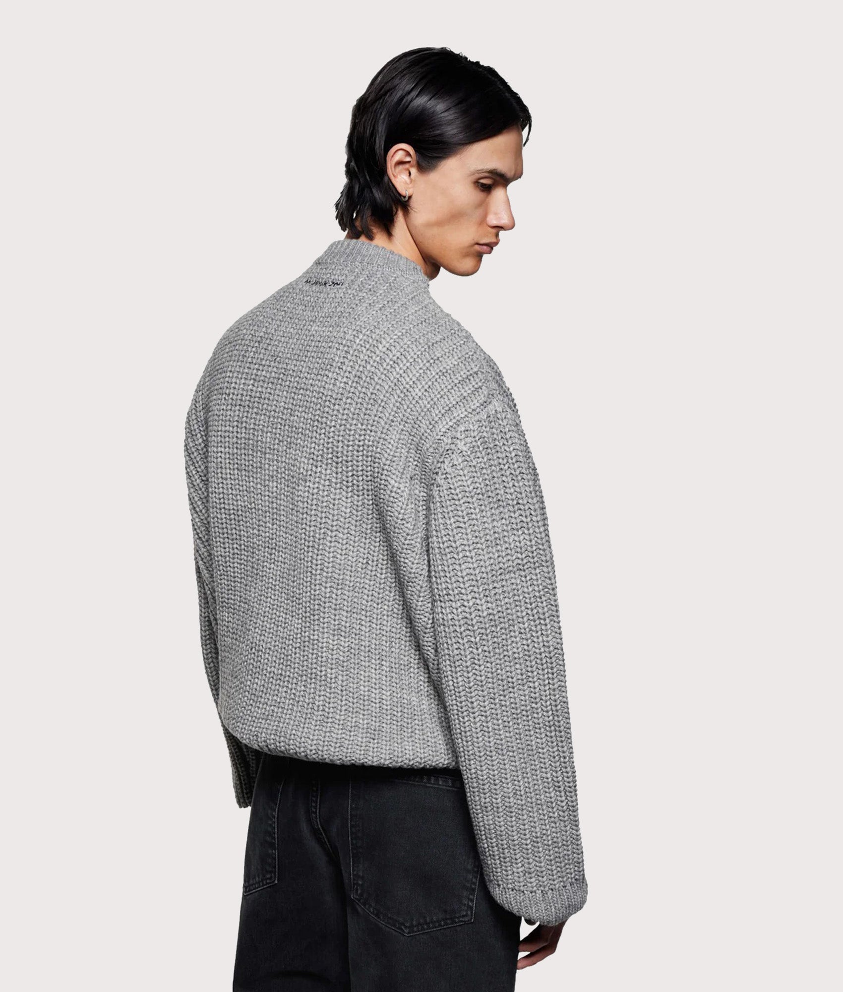 MKI MIYUKI ZOKU Oversized Chunky Rib Knit Crewneck Jumper in Grey Melange at EQVVS Menswear. Angled model back shot. 