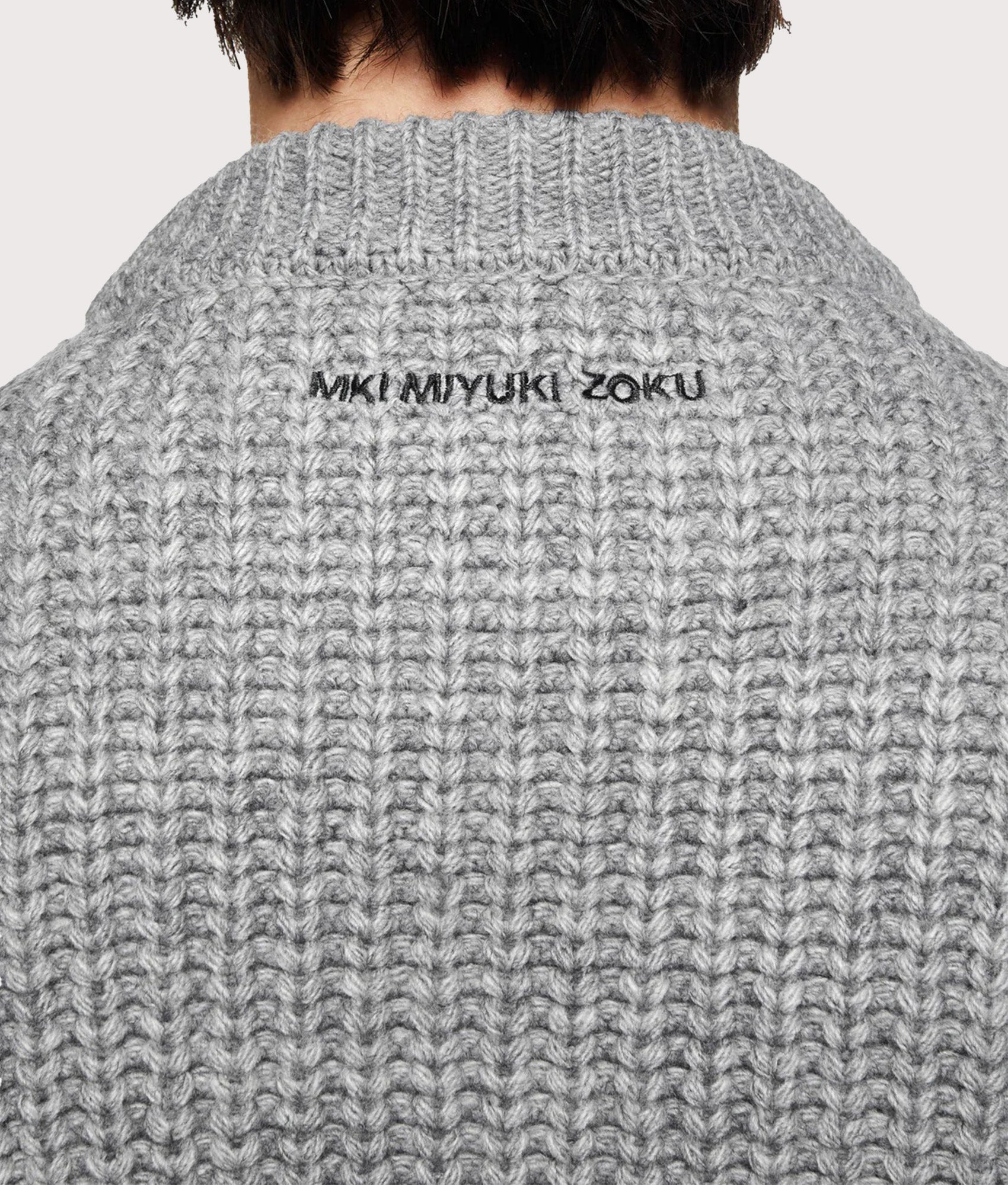 MKI MIYUKI ZOKU Oversized Chunky Rib Knit Crewneck Jumper in Grey Melange at EQVVS Menswear. Back detail shot.