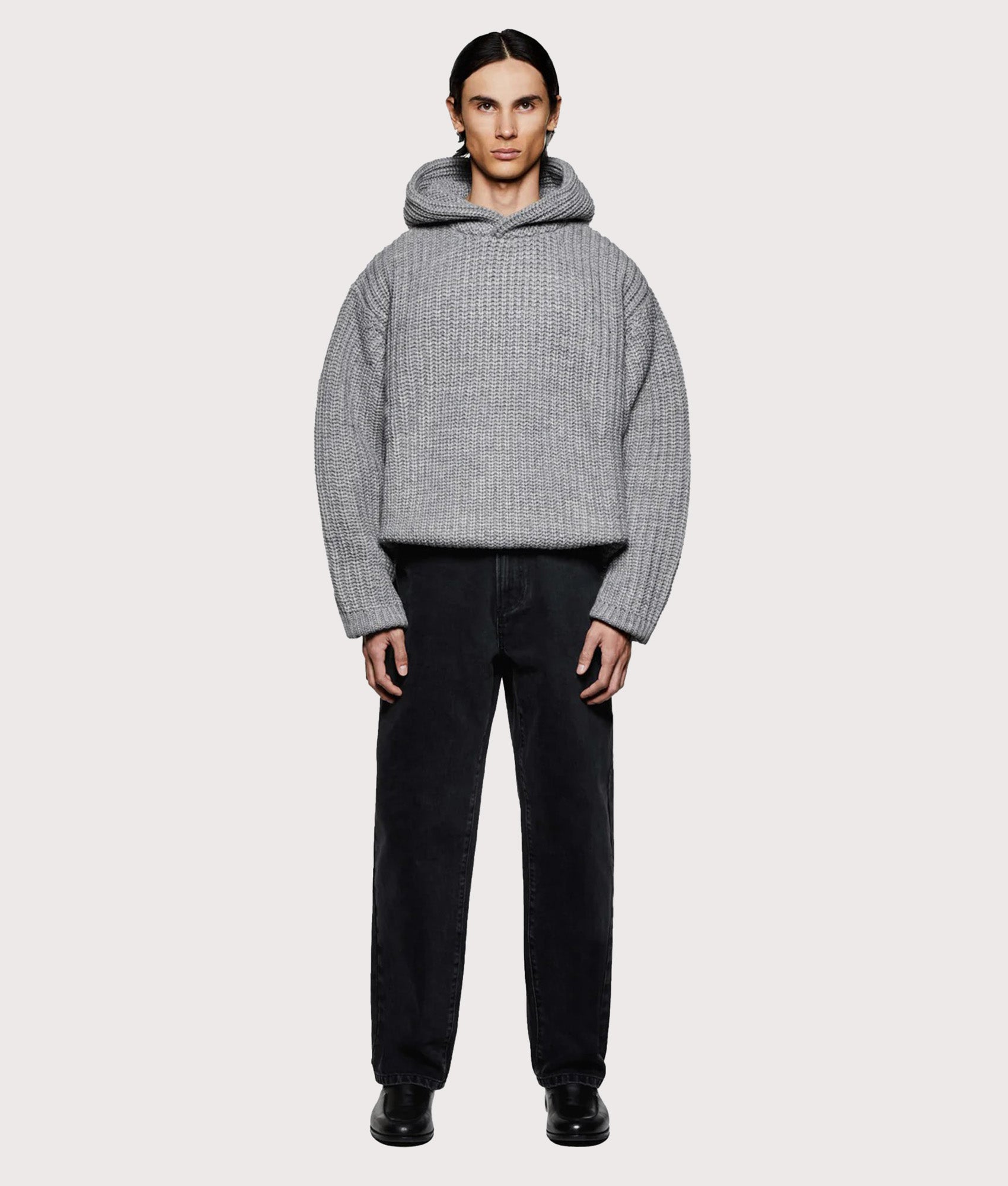 MKI MIYUKI ZOKU Oversized Chunky Ribbed Knit Hoodie in Grey Melange at EQVVS Menswear. Model full front shot.