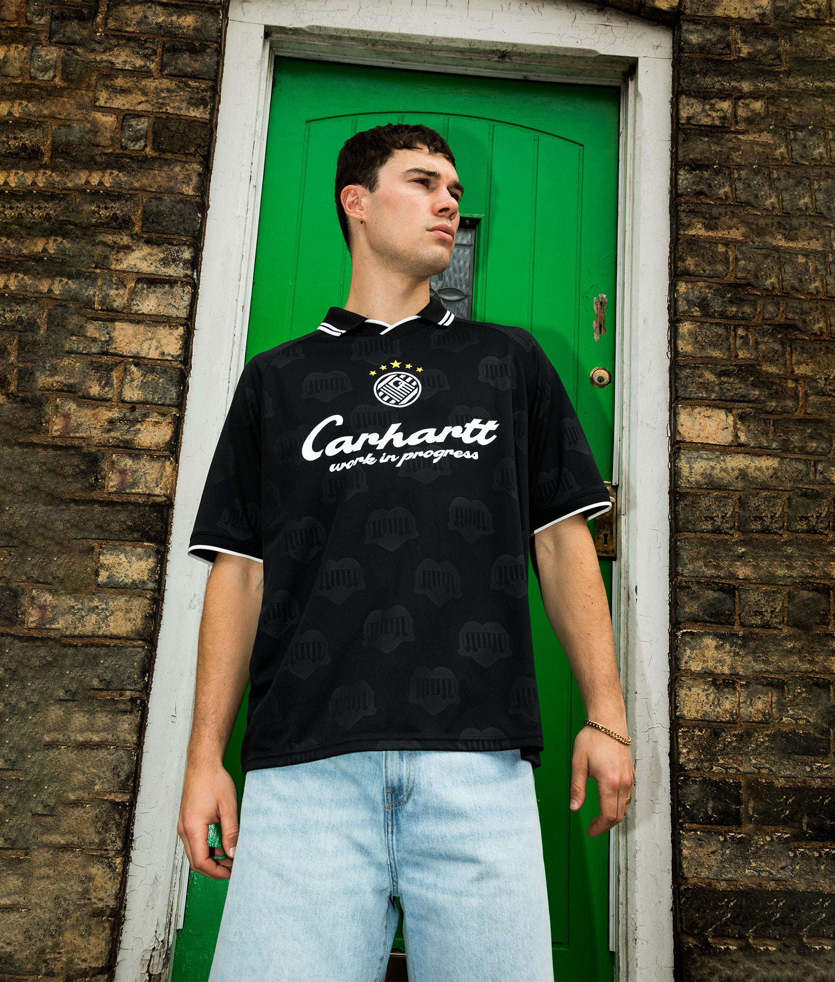 Carhartt WIP Loose Fit Terrace Football T-Shirt in Heart Train Jacquard and Black at EQVVS Menswear. Campaign shot.